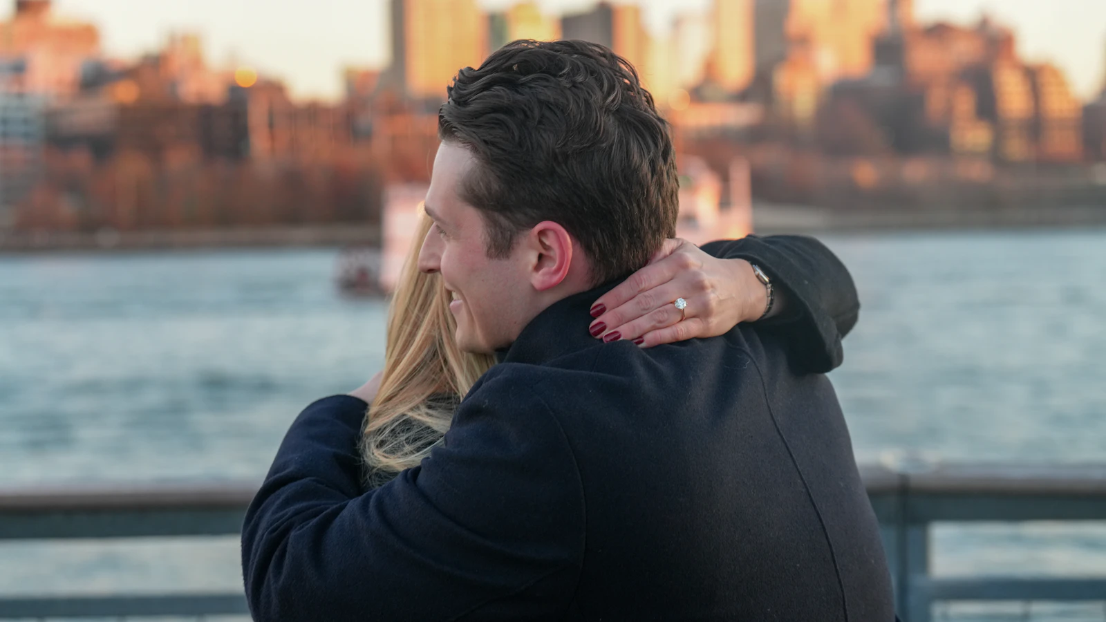 Olivia and Ethan hugging on the pier