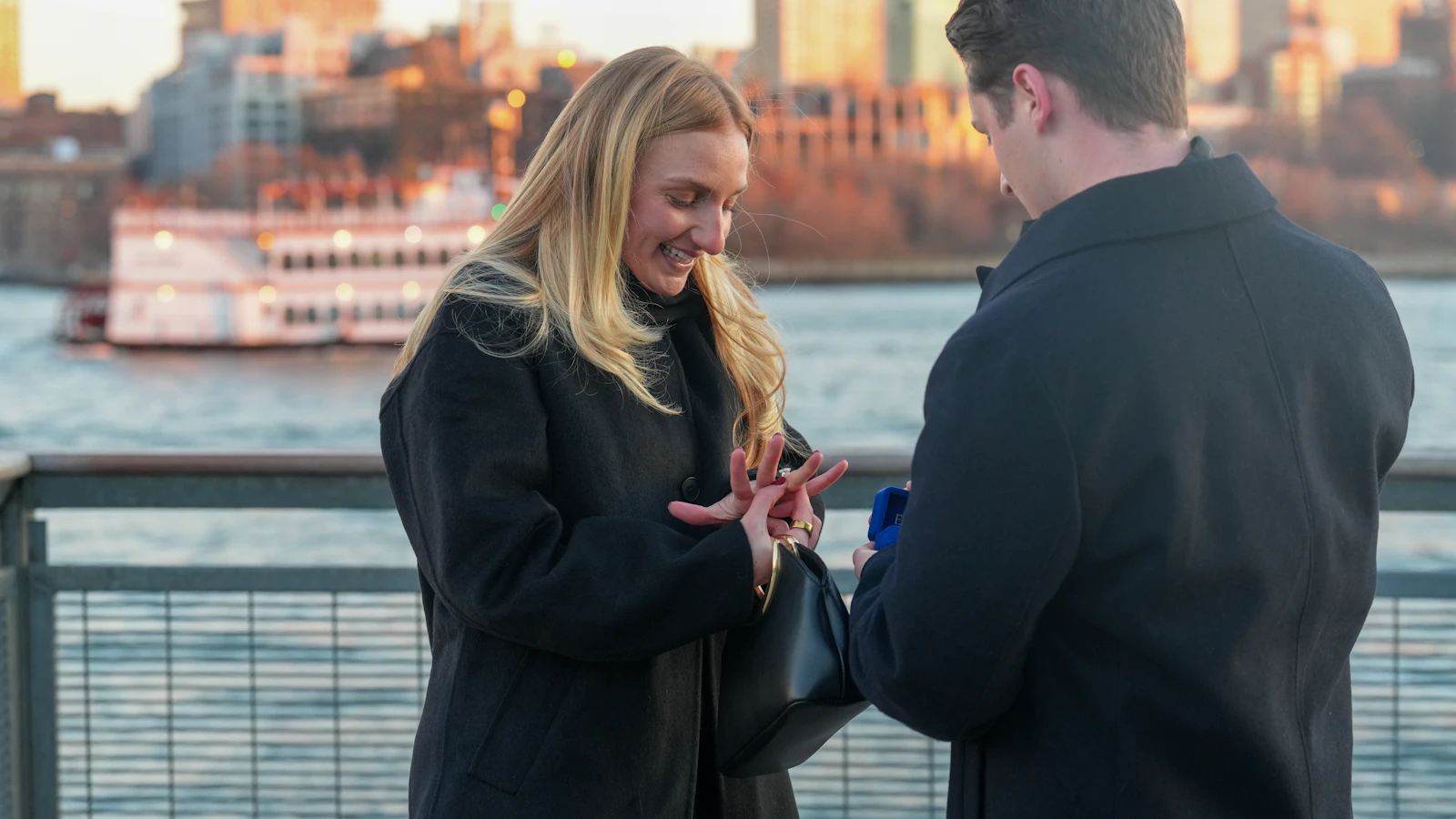 Ethan proposing to Olivia by the water