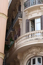 Ornate balconies and windows on a building