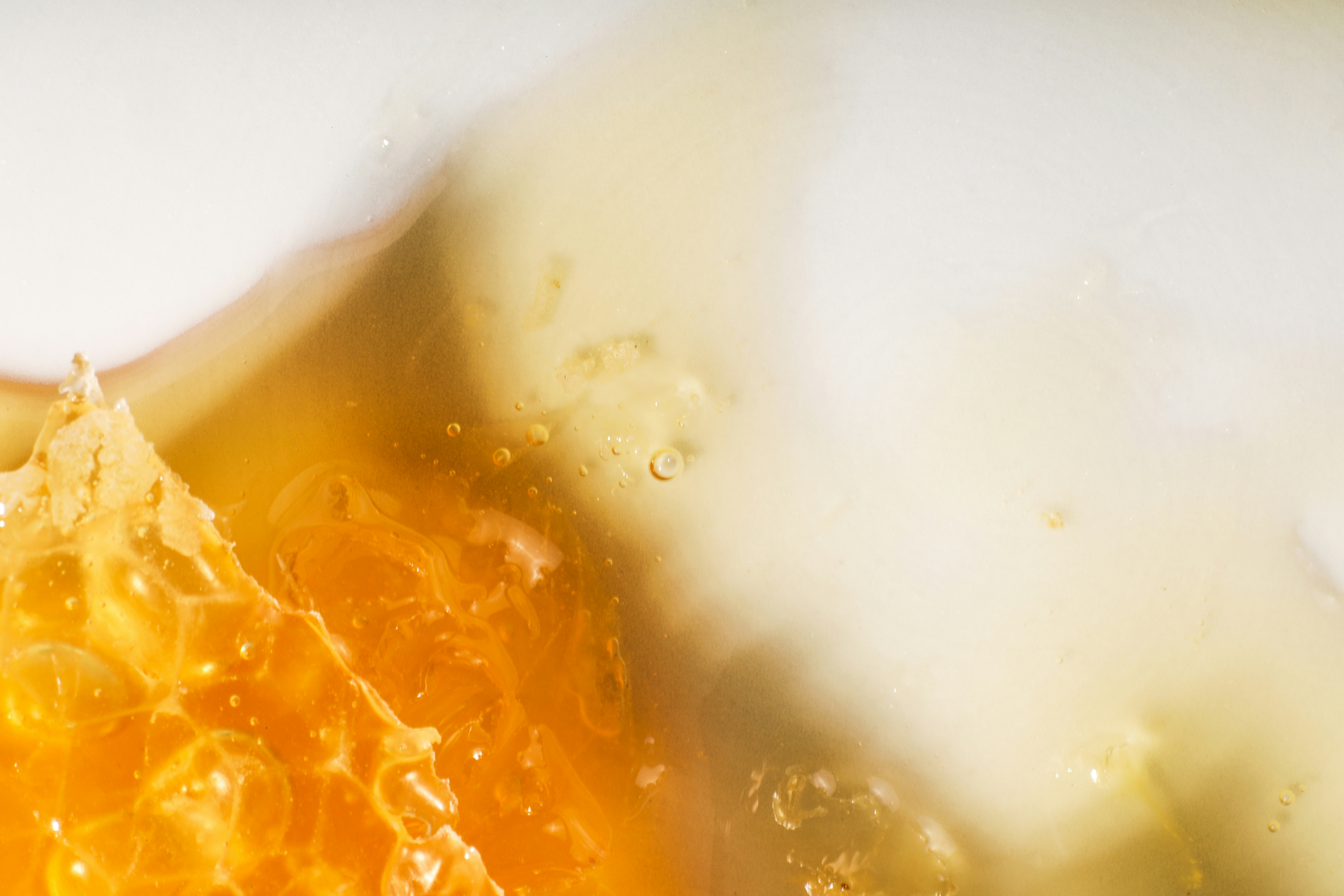 Close-up of a juicy orange slice with bubbles.