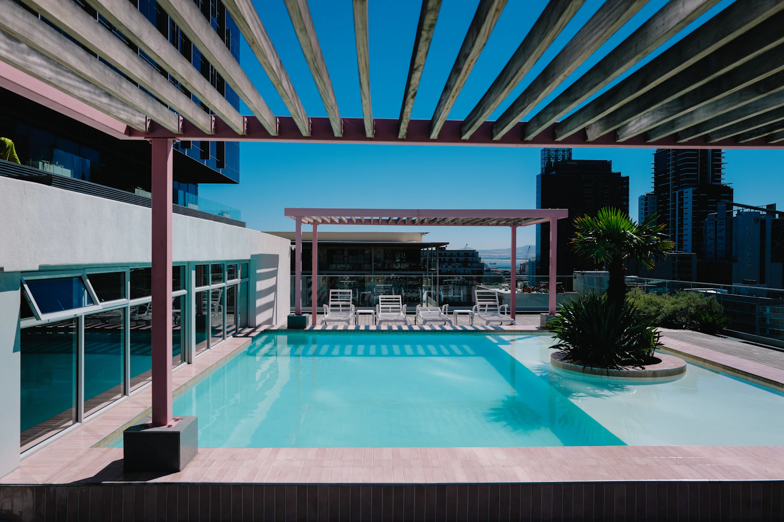 Infinity-edge rooftop pool overlooking the city skyline