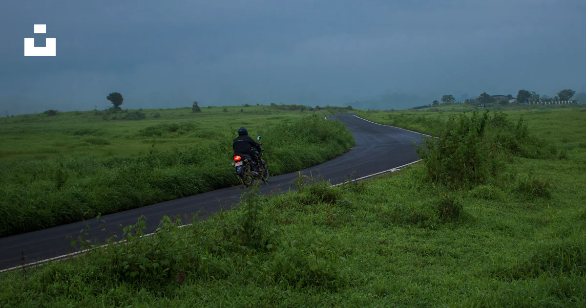 Rural Motorcycle Riding Person riding motorcycle on a rural road photo – Free Travel Image on ...