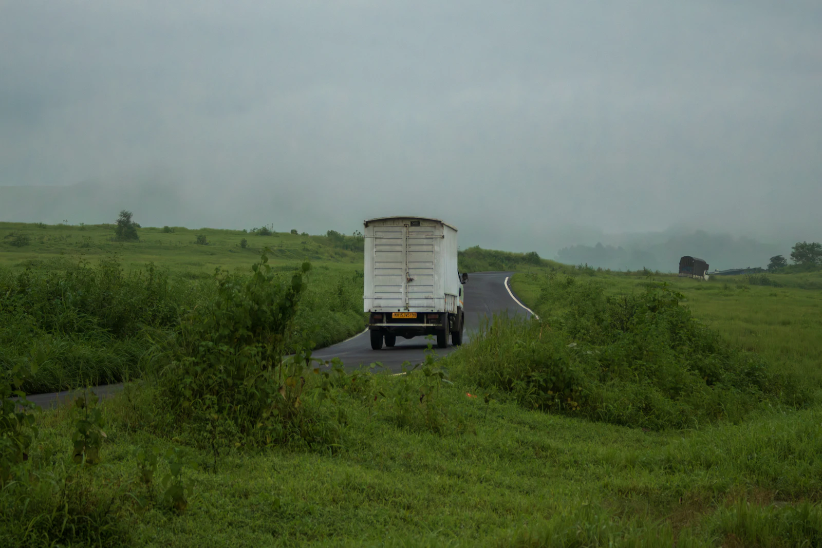 White box truck on a rural highway