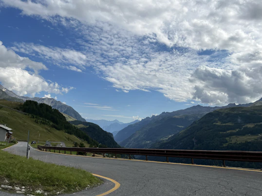 Winding mountain road with scenic valley view
