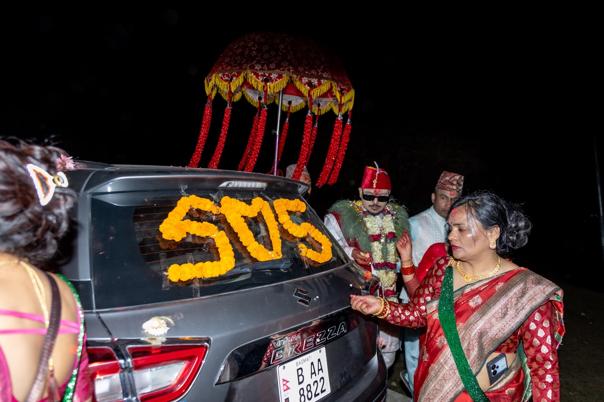 Wedding car at night, decorated with flowers