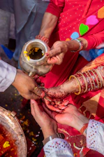 Hands performing a ritual with water and flowers