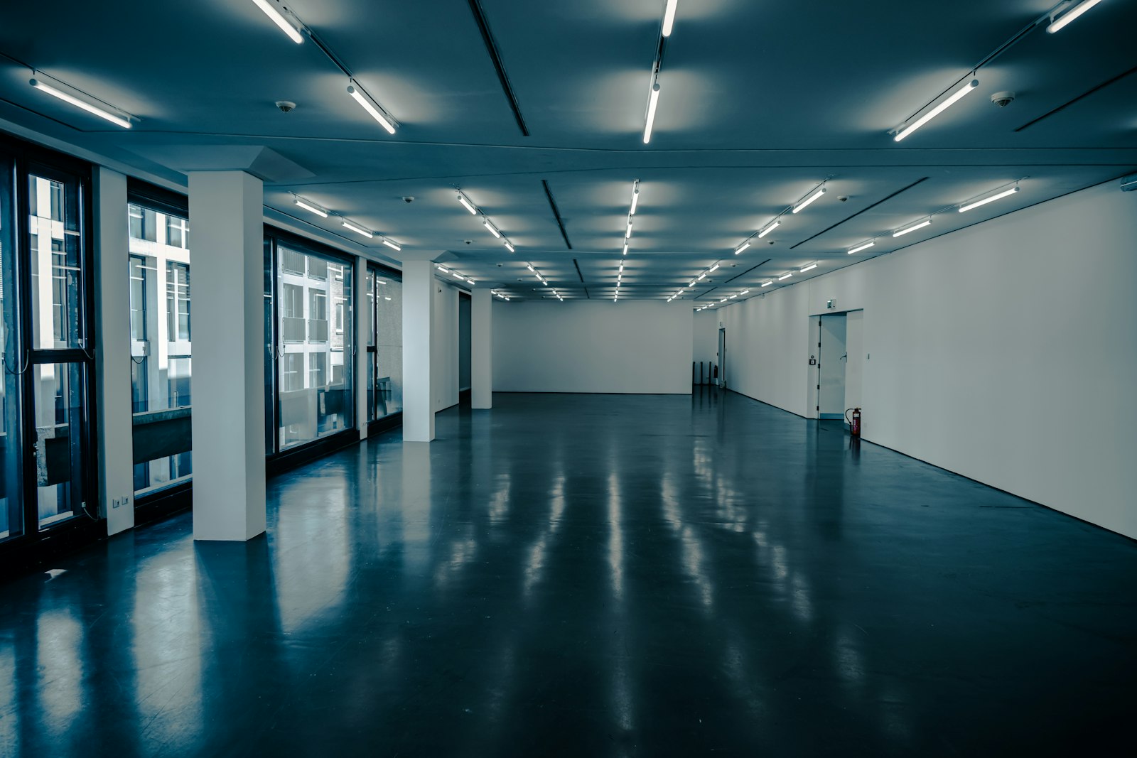 Dark polished concrete floor with soft reflections