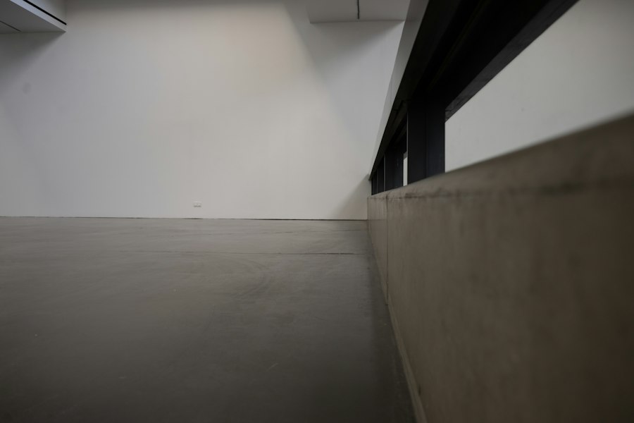 A swept polished concrete floor in a bright empty room