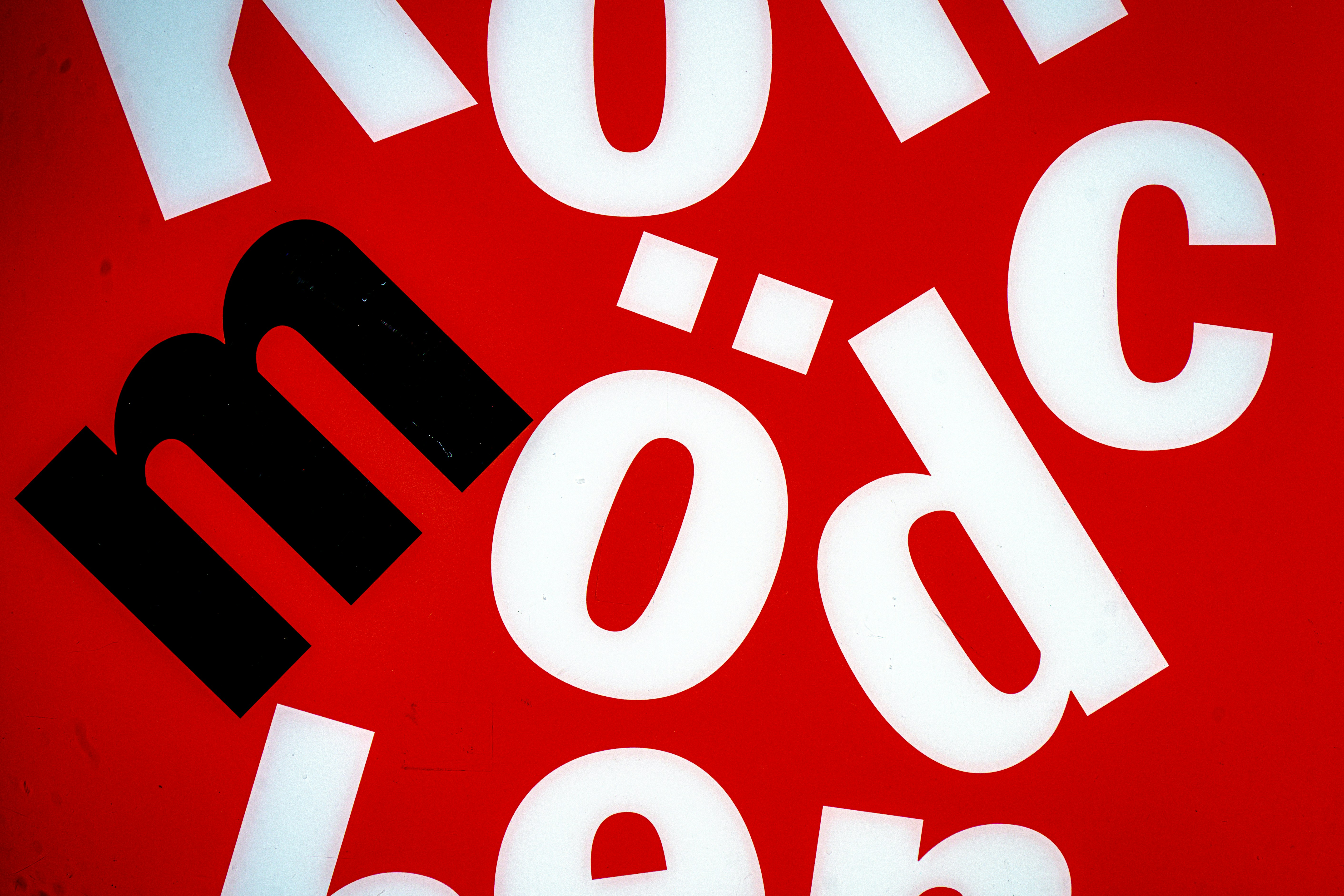 White and black letters on a red background