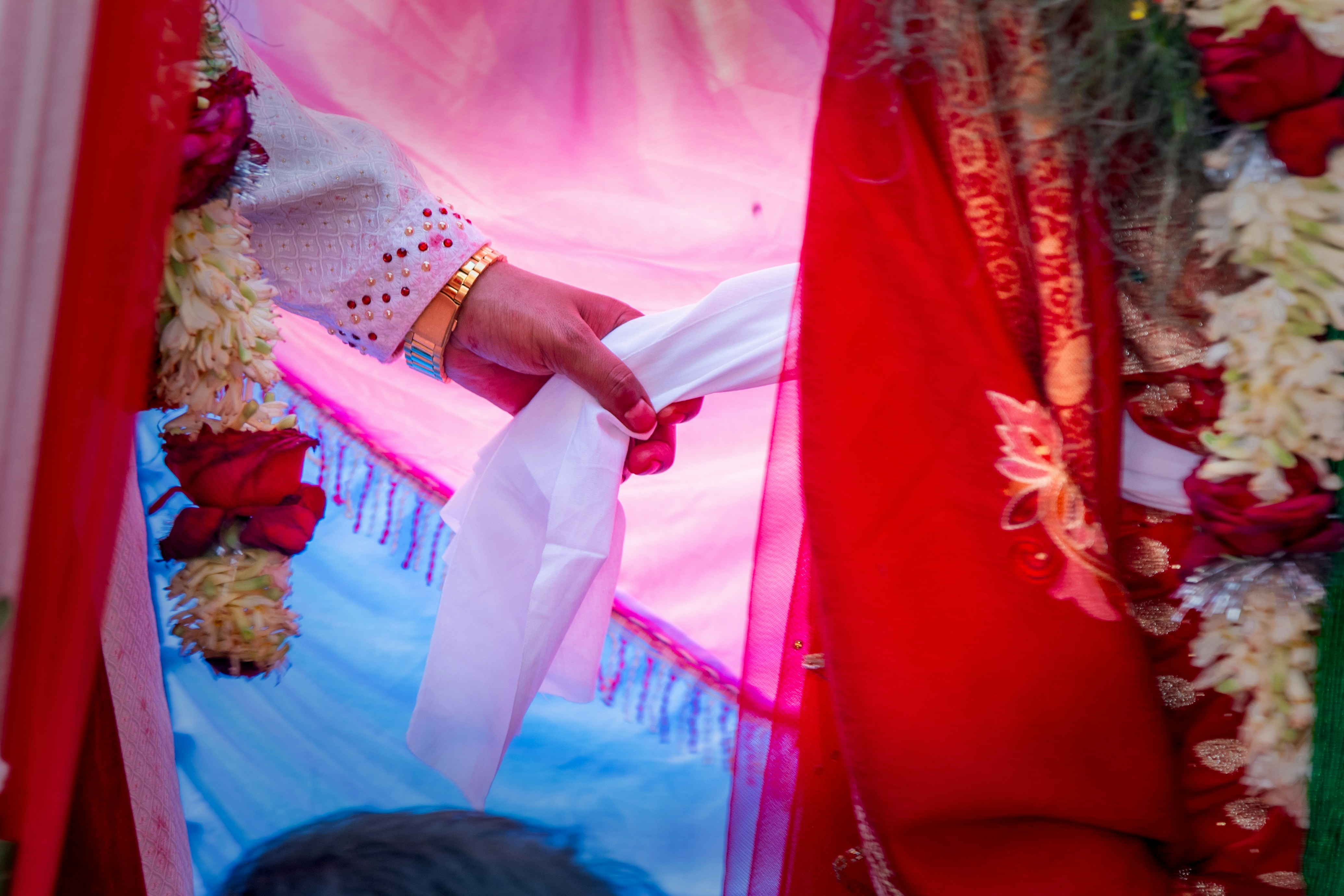 Pheras ceremony at lakeside mandap during dusk