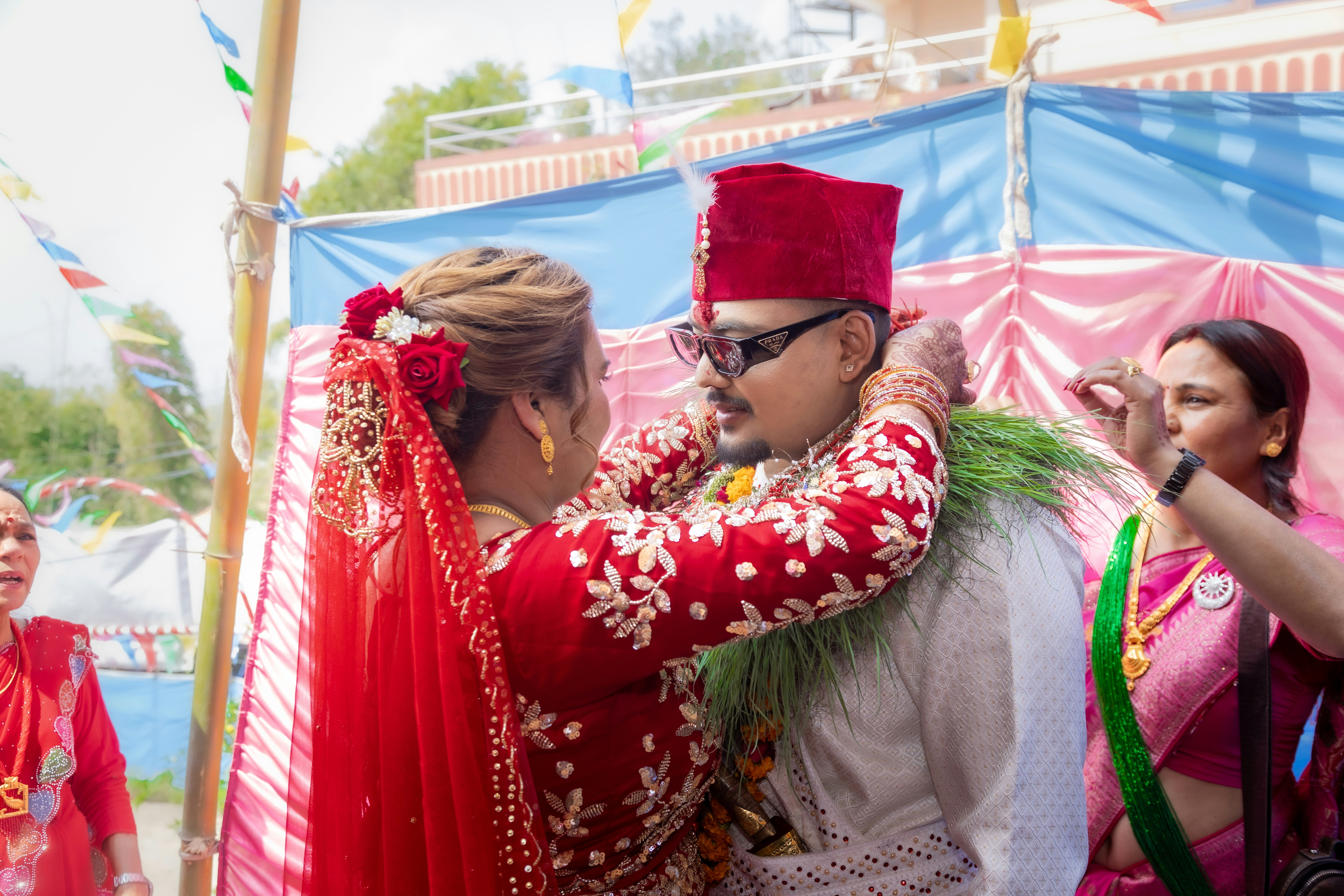 Bride and Groom Exchanging Malas and Rings | Nepali Swayambar Ceremony. During a Nepali Swayambar ceremony, the bride and groom exchange malas around each other’s necks and rings, symbolizing their love and commitment. Surrounded by family and blessings at the mandap, this sacred ritual honors mutual consent, celebrates rich cultural traditions, and marks the joyful beginning of their journey toward marriage.