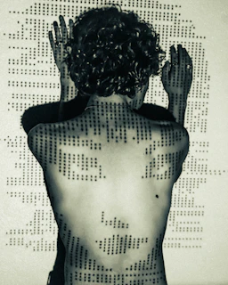 Person with dots projected onto their back and arms