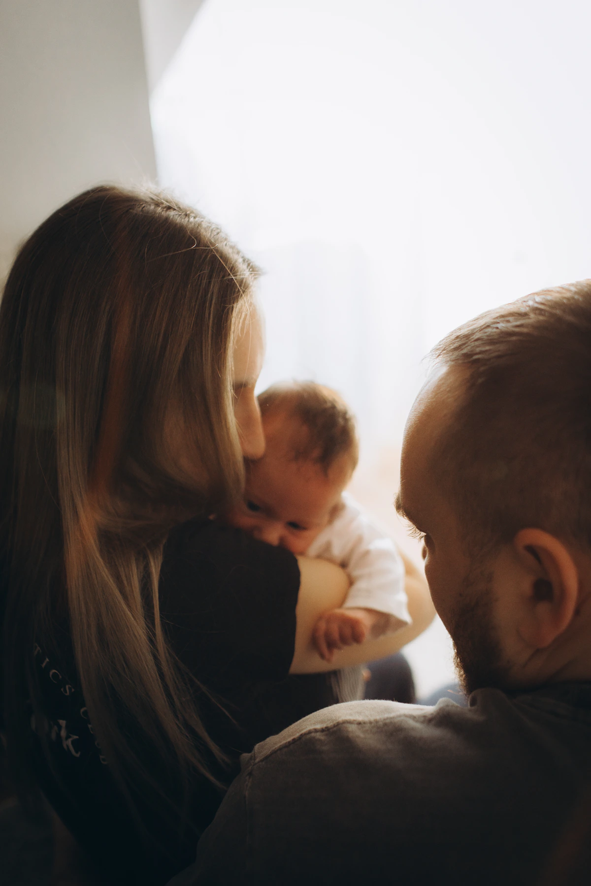 Parents holding newborn baby