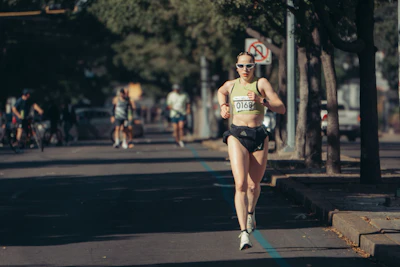 Woman running in a race on a sunny street