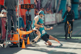 Runners collapse at finish line after race.