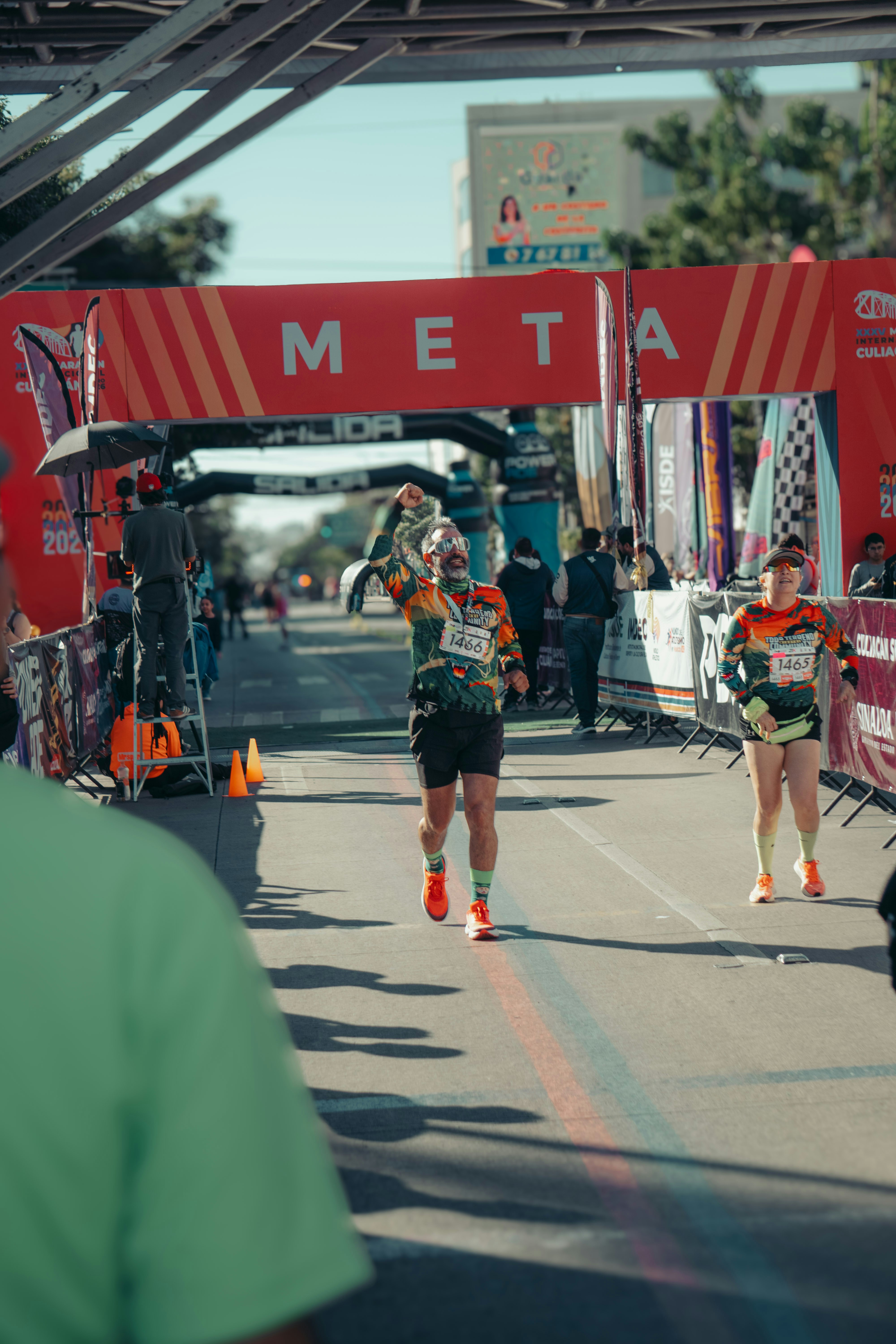 Runner crosses finish line at marathon event