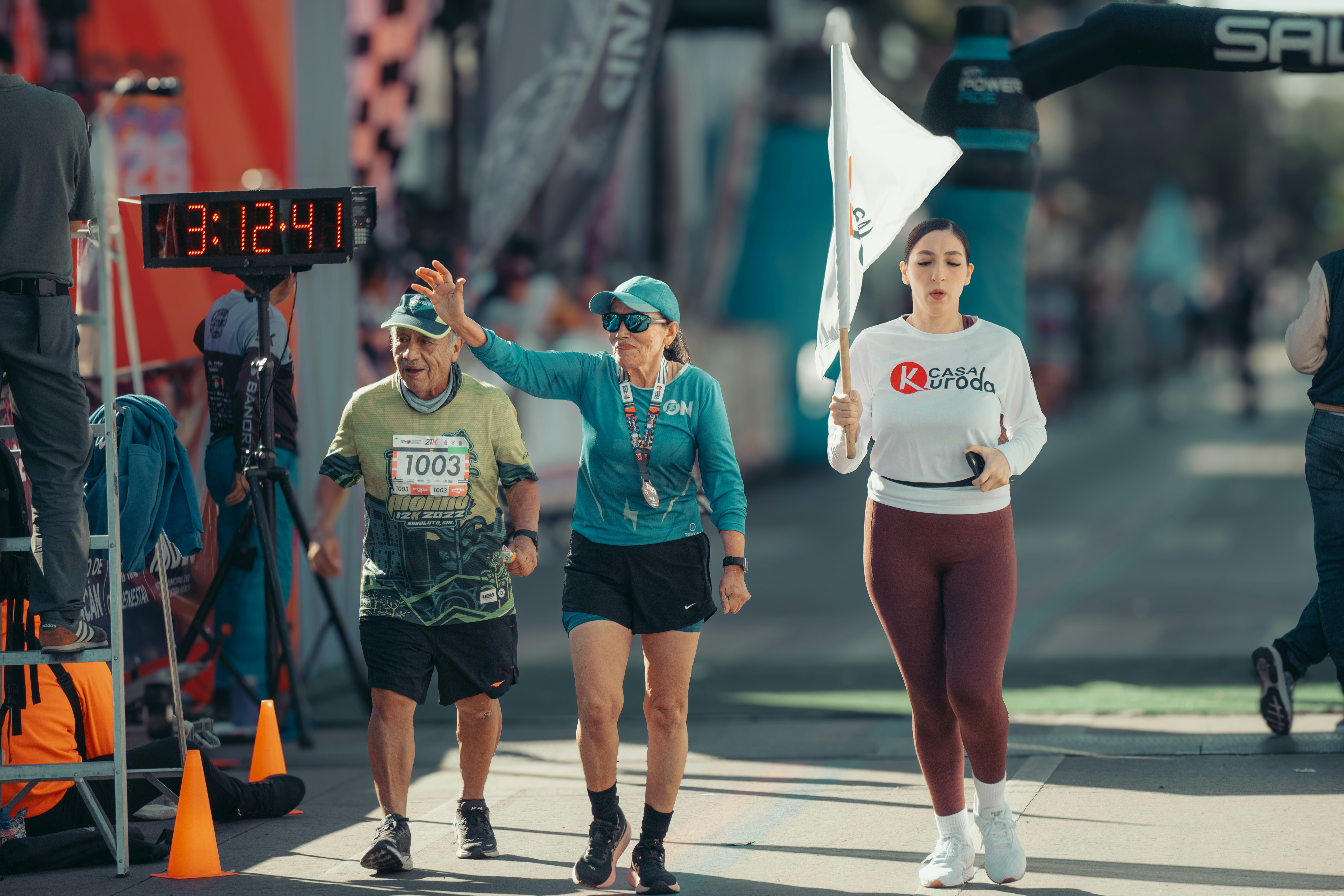 Runners cross the finish line at a race.