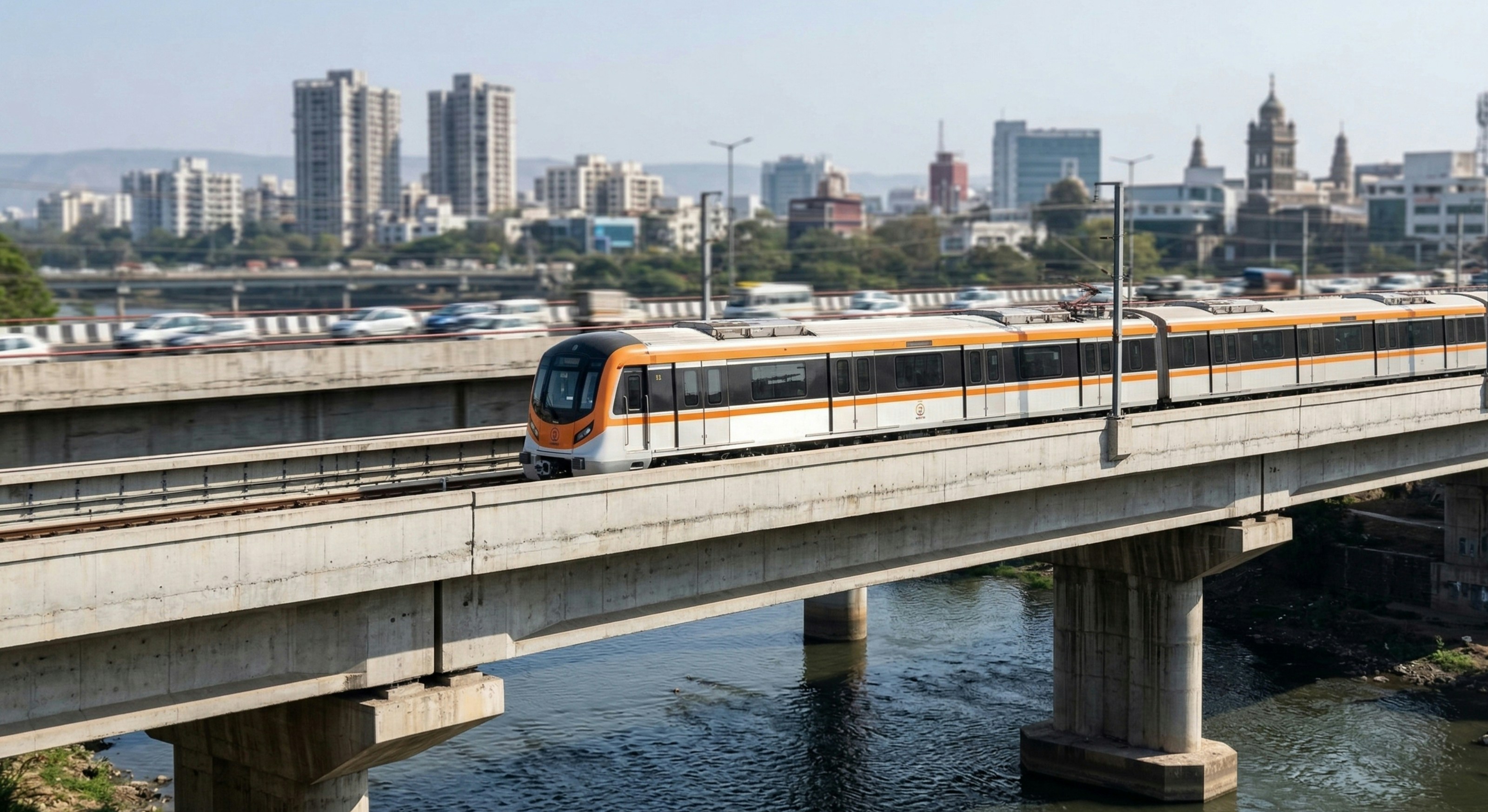 A modern train travels on an elevated track over water