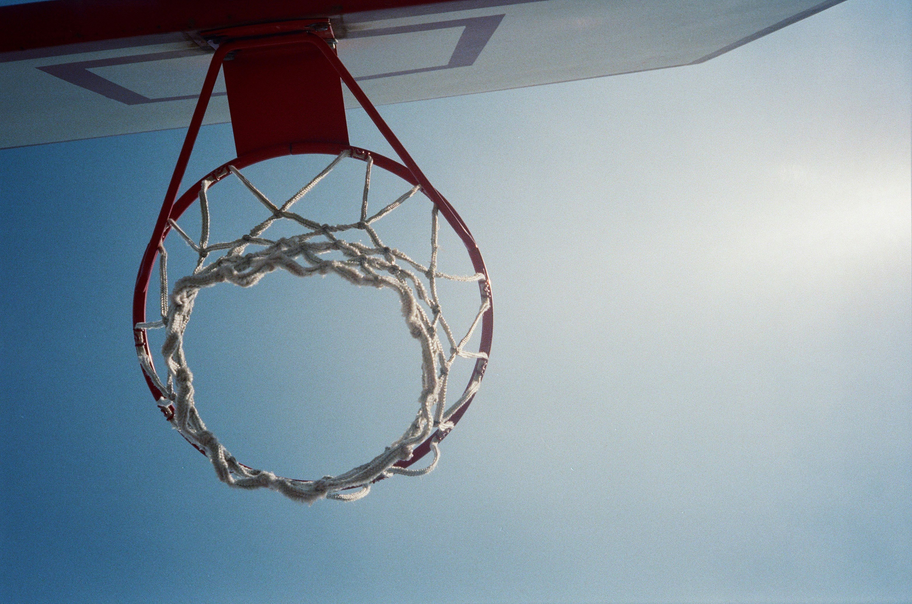 Basketball hoop against a clear blue sky