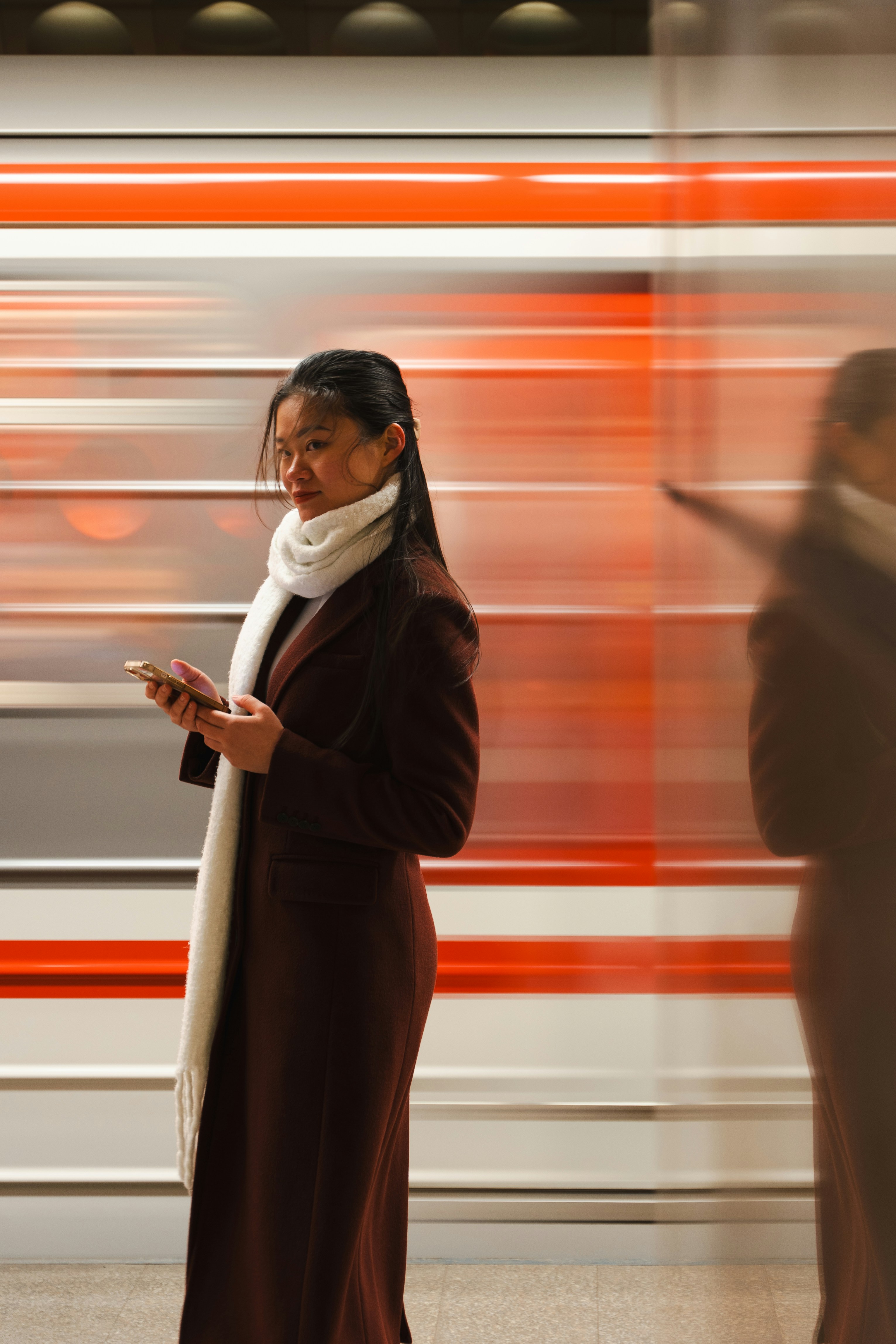 Woman looking at phone with blurred background