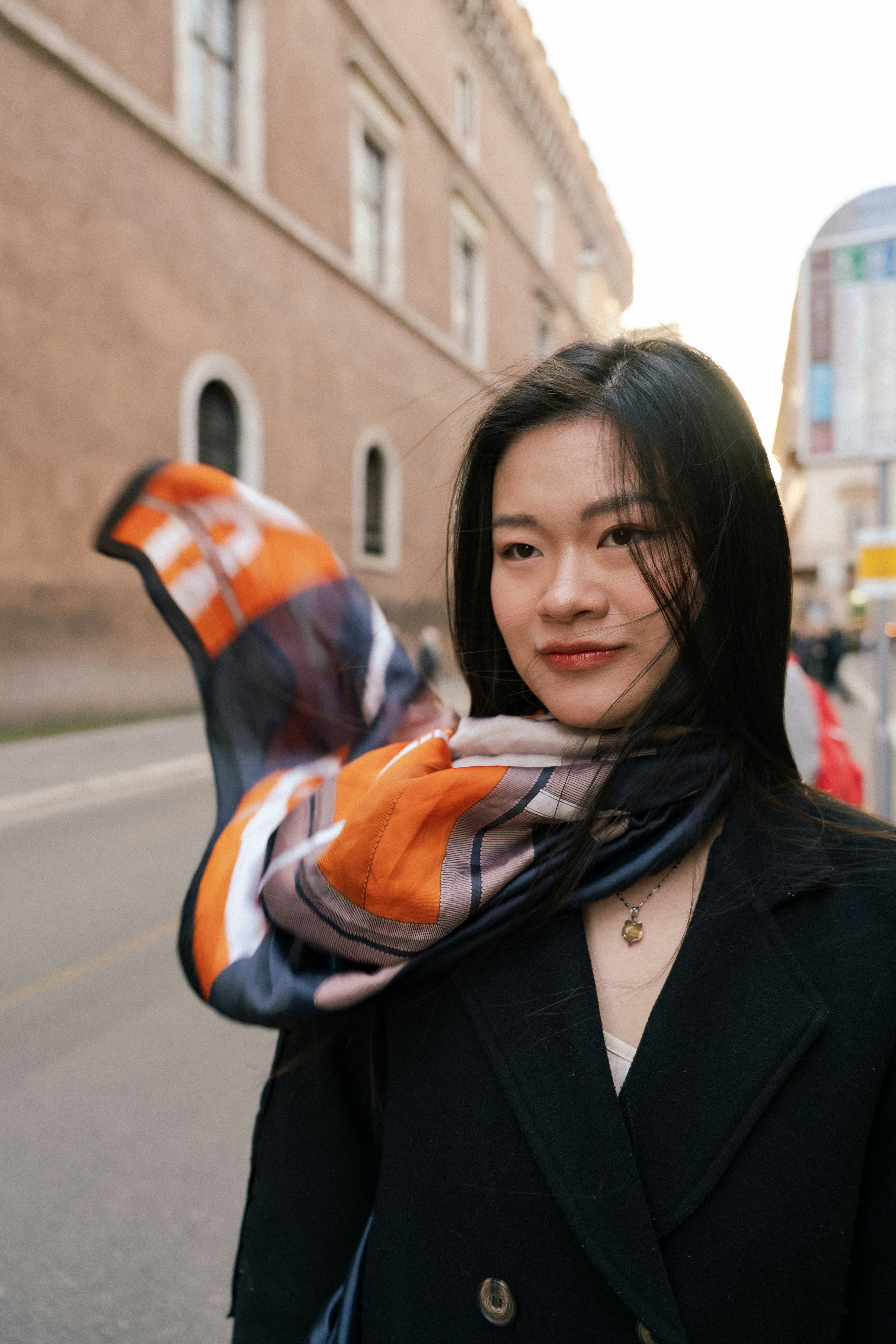 Young woman with a colorful scarf outdoors