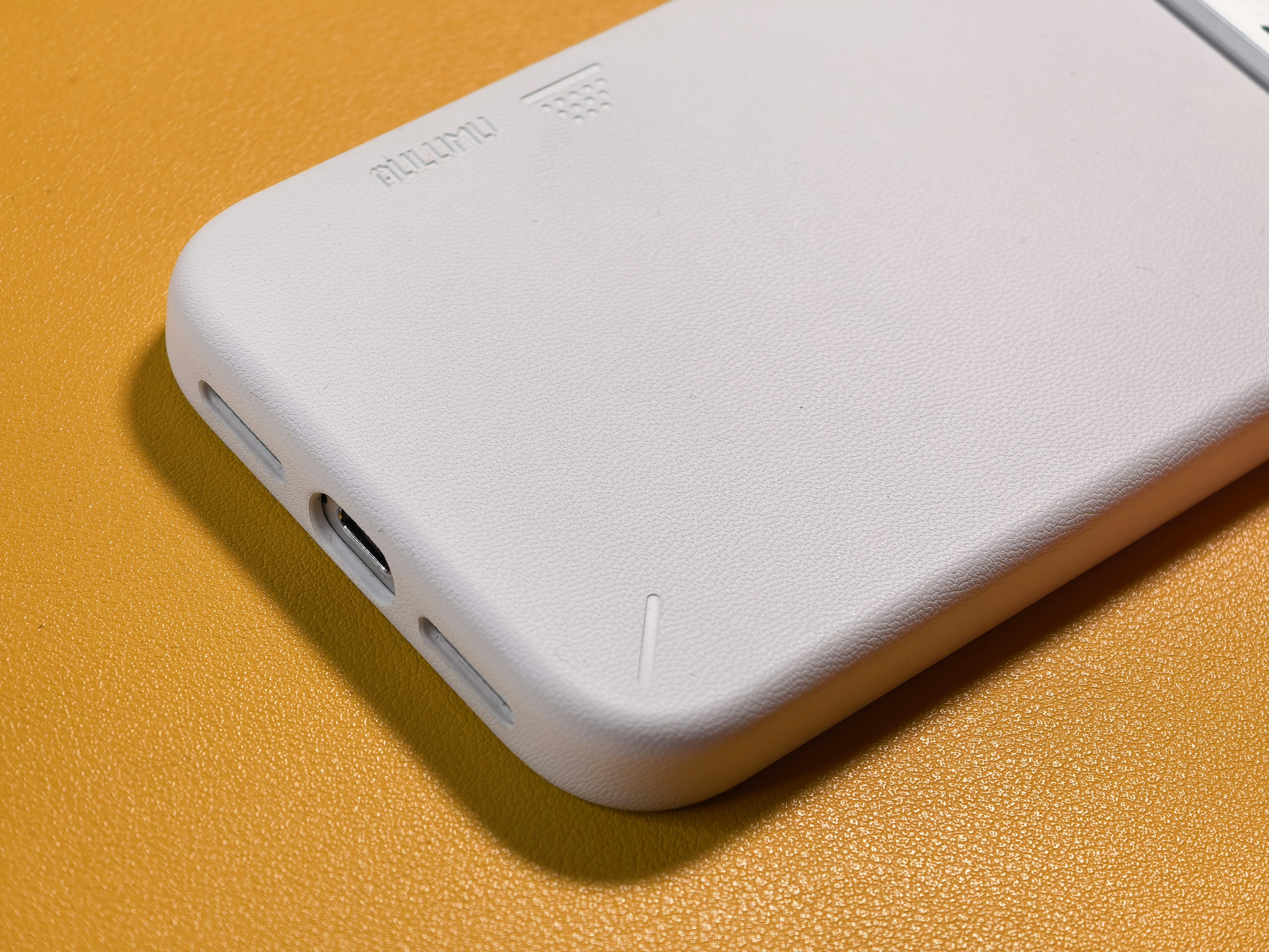White smartphone case with charging ports on side