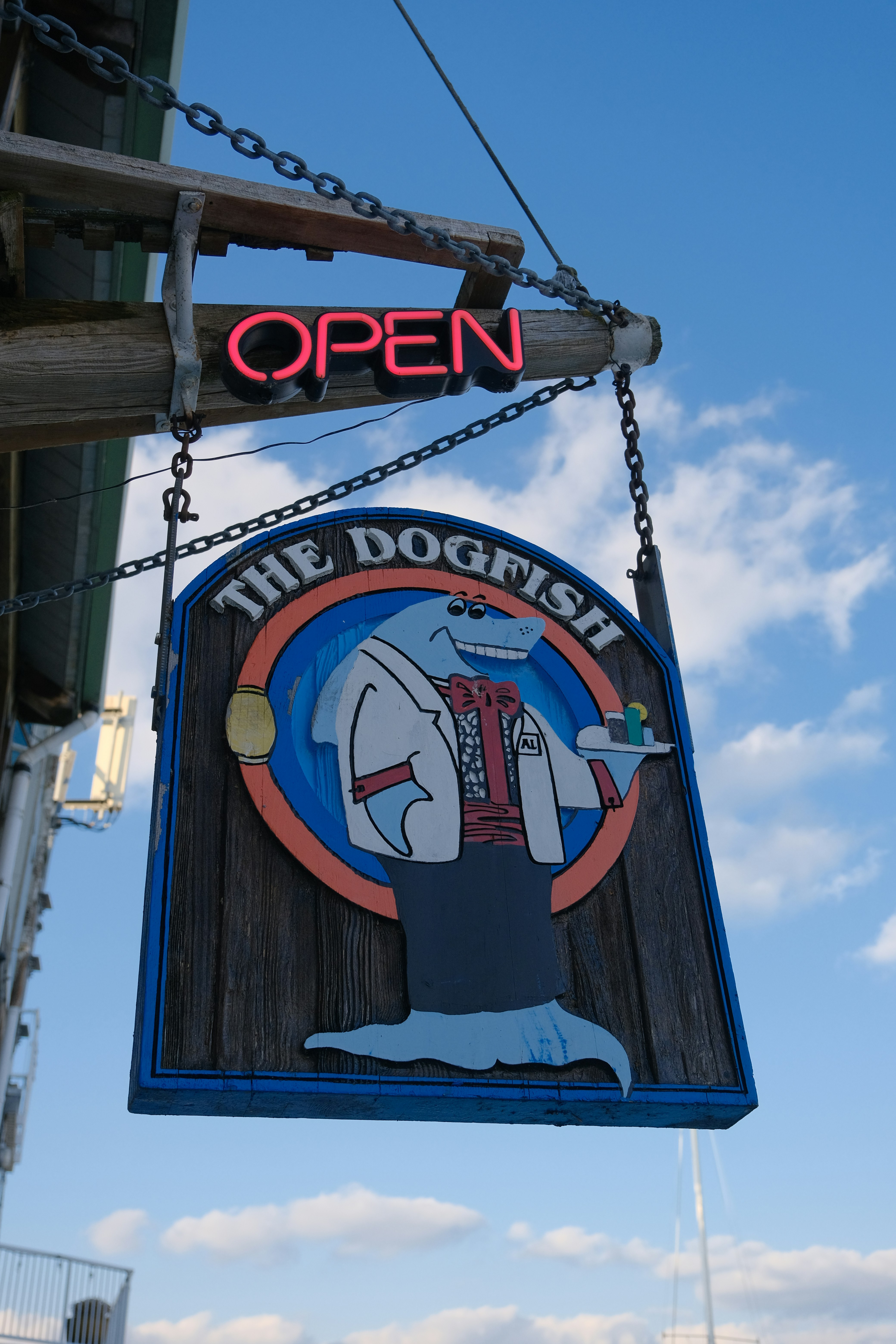 The dogfish restaurant sign with neon open light