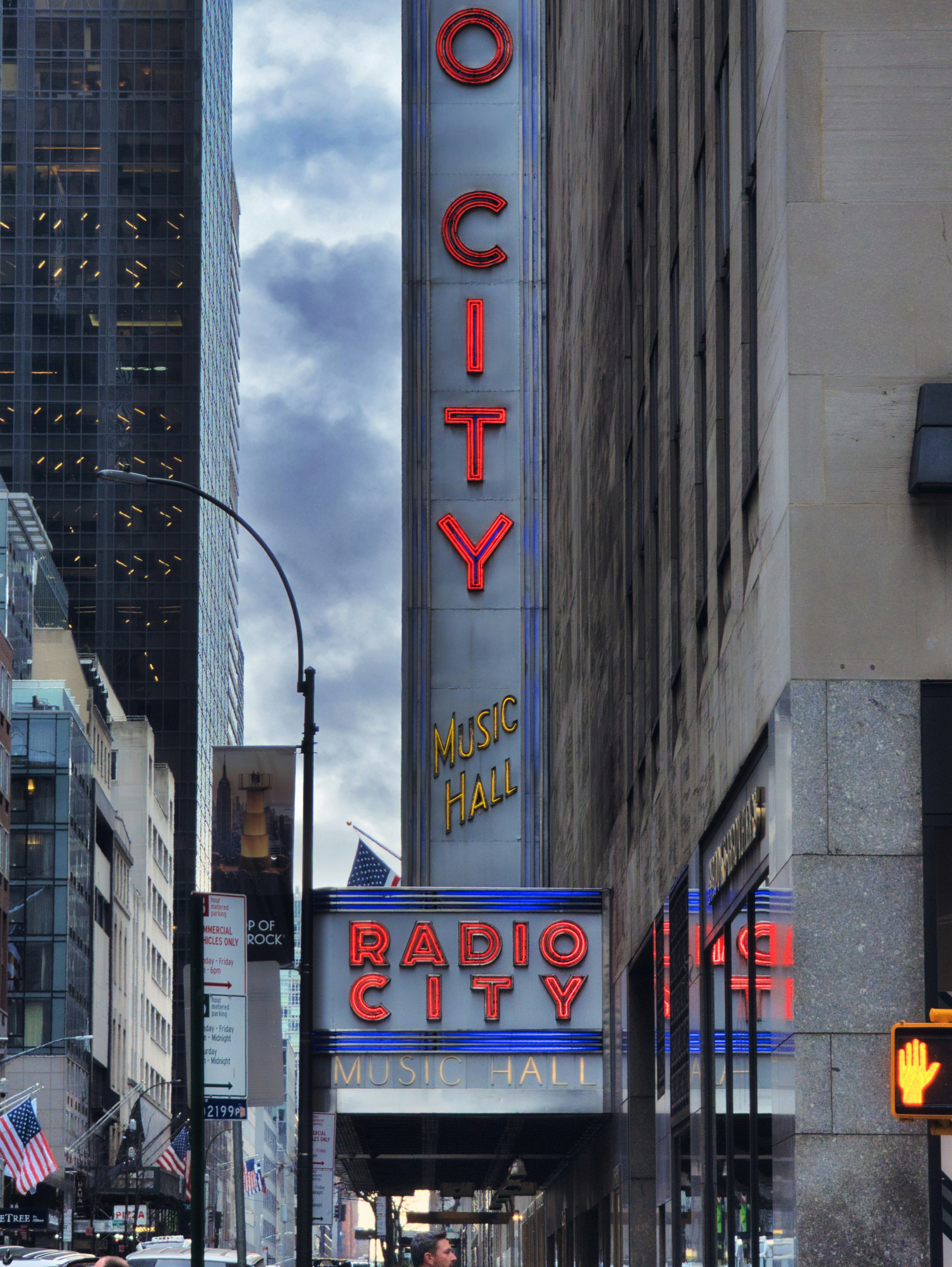 Radio city music hall building facade with neon signs