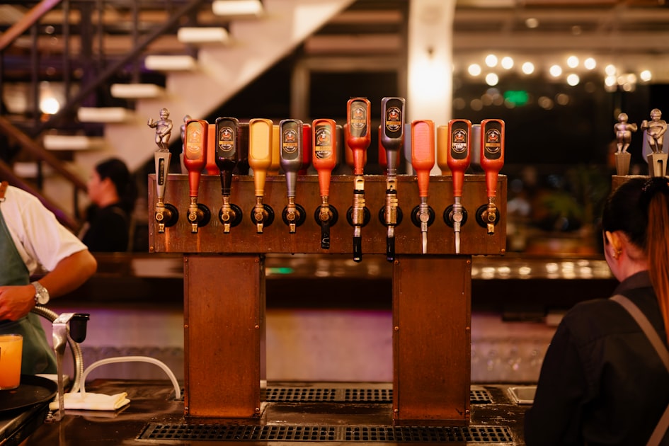 Rows of craft beer taps at a Hong Kong brewery taproom