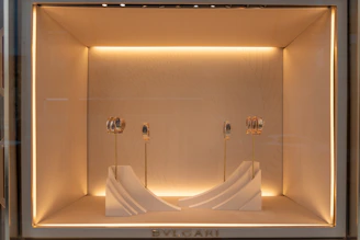 Luxury jewelry display in a well-lit boutique window
