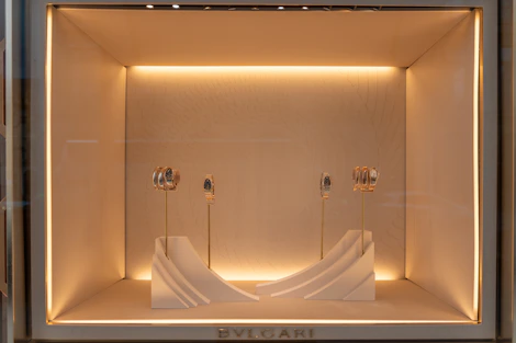 Luxury jewelry display in a well-lit boutique window