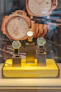 Three luxury watches displayed in a store window