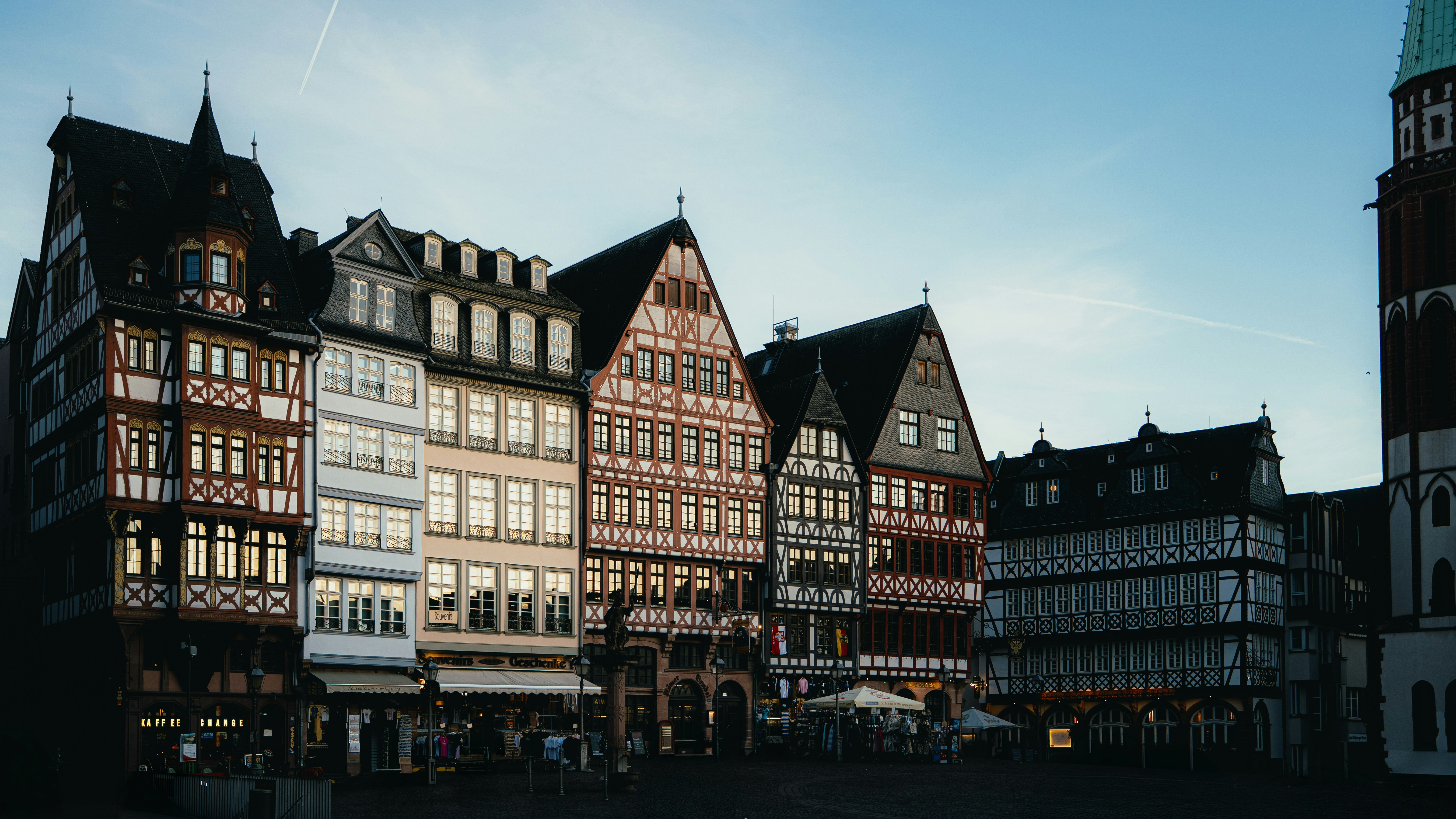 Row of colorful, historic european buildings under a clear sky