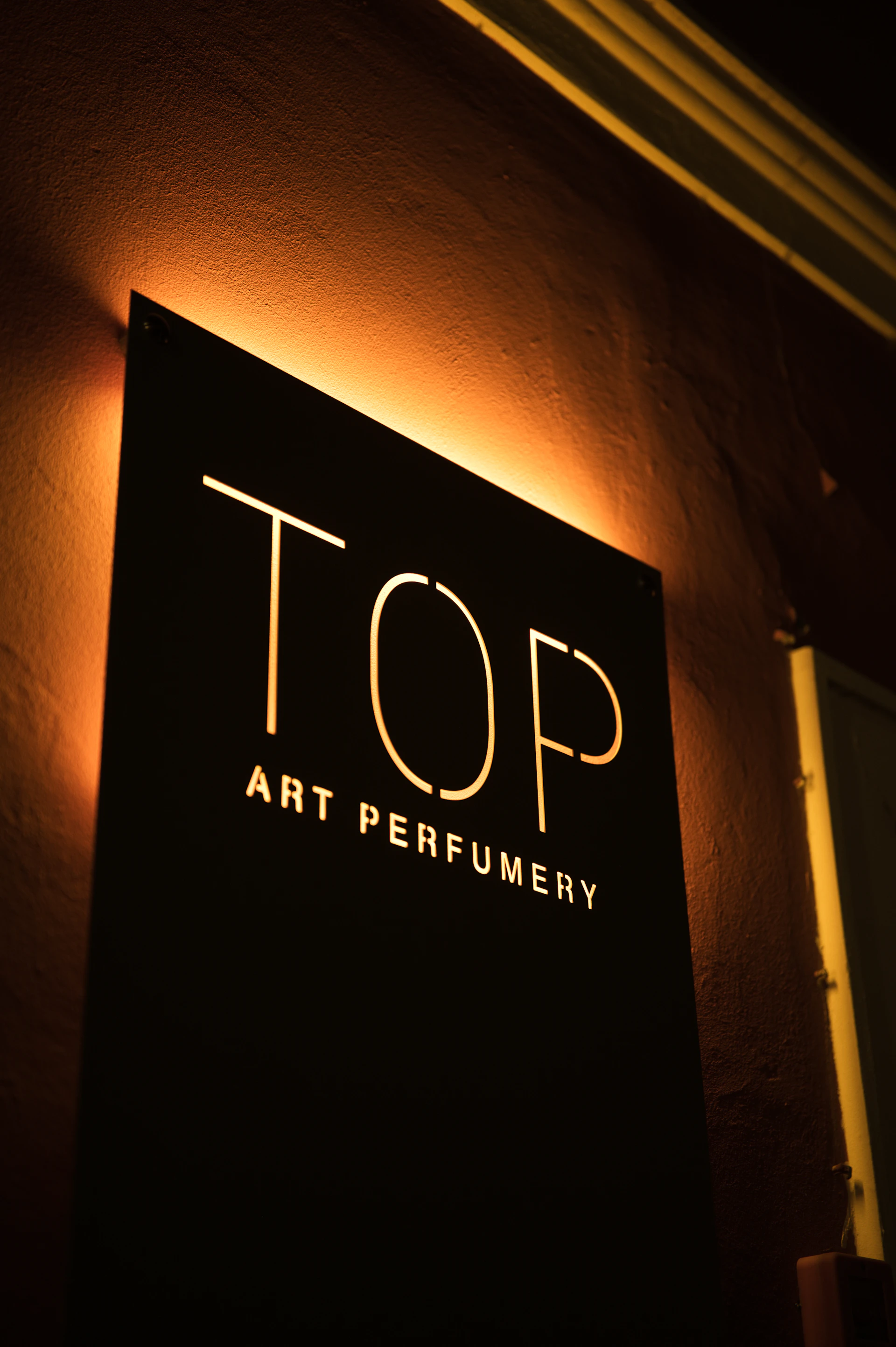 Illuminated sign for top art perfumery