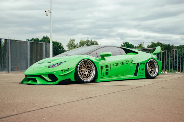 A lime green sports car with custom modifications