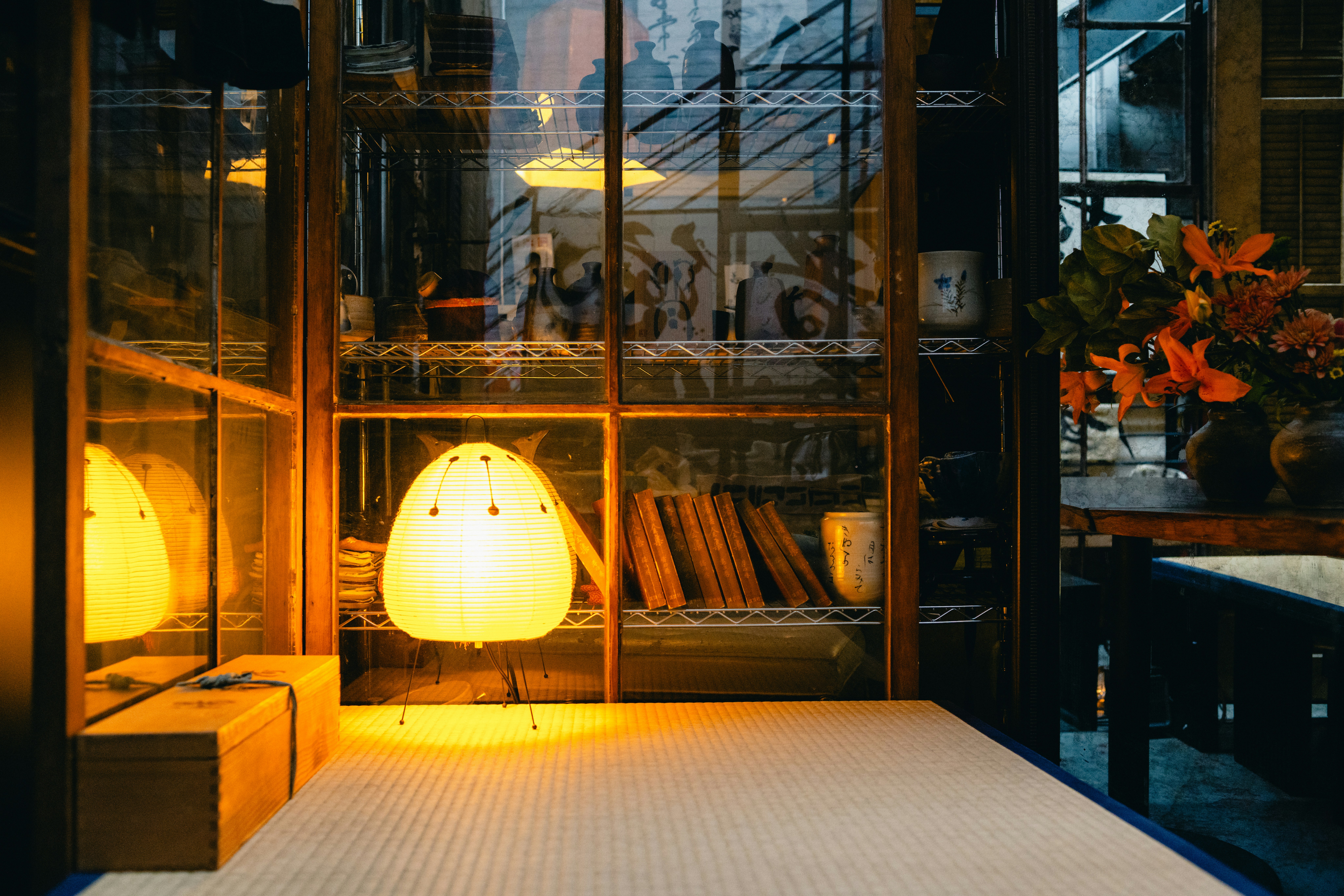 A child happily curled up with a book in a cozy reading nook, surrounded by cushions and soft light.