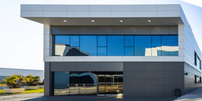 Modern office building with large blue glass windows