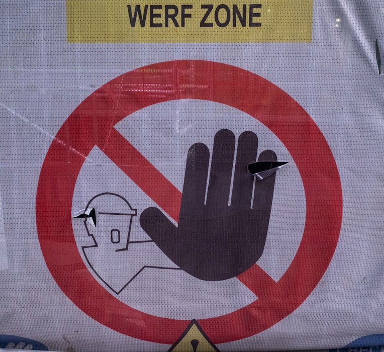 No entry prohibition sign with hand symbol - example of standard prohibition safety signage in workplace