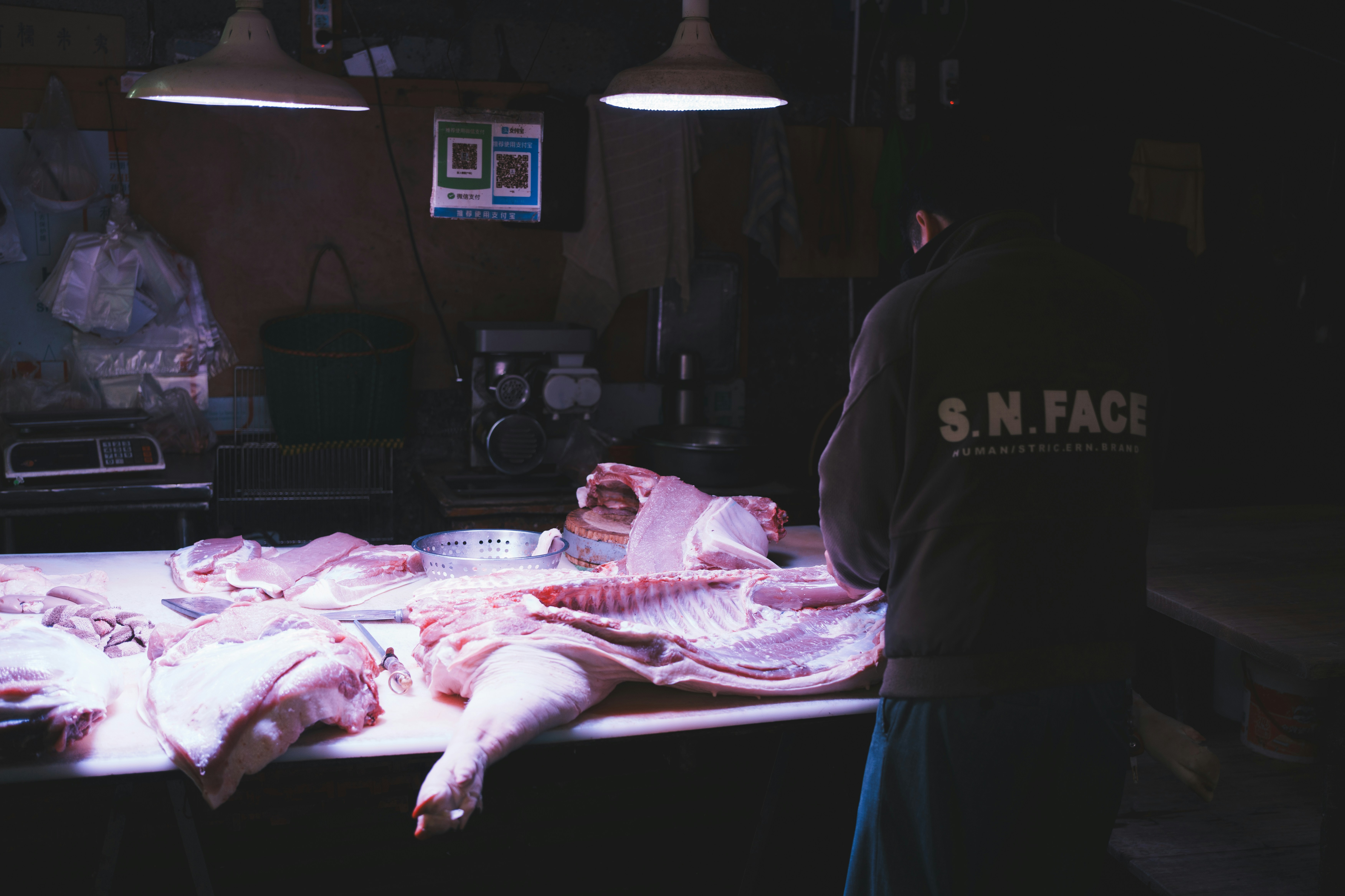 Butcher preparing raw pork on a table