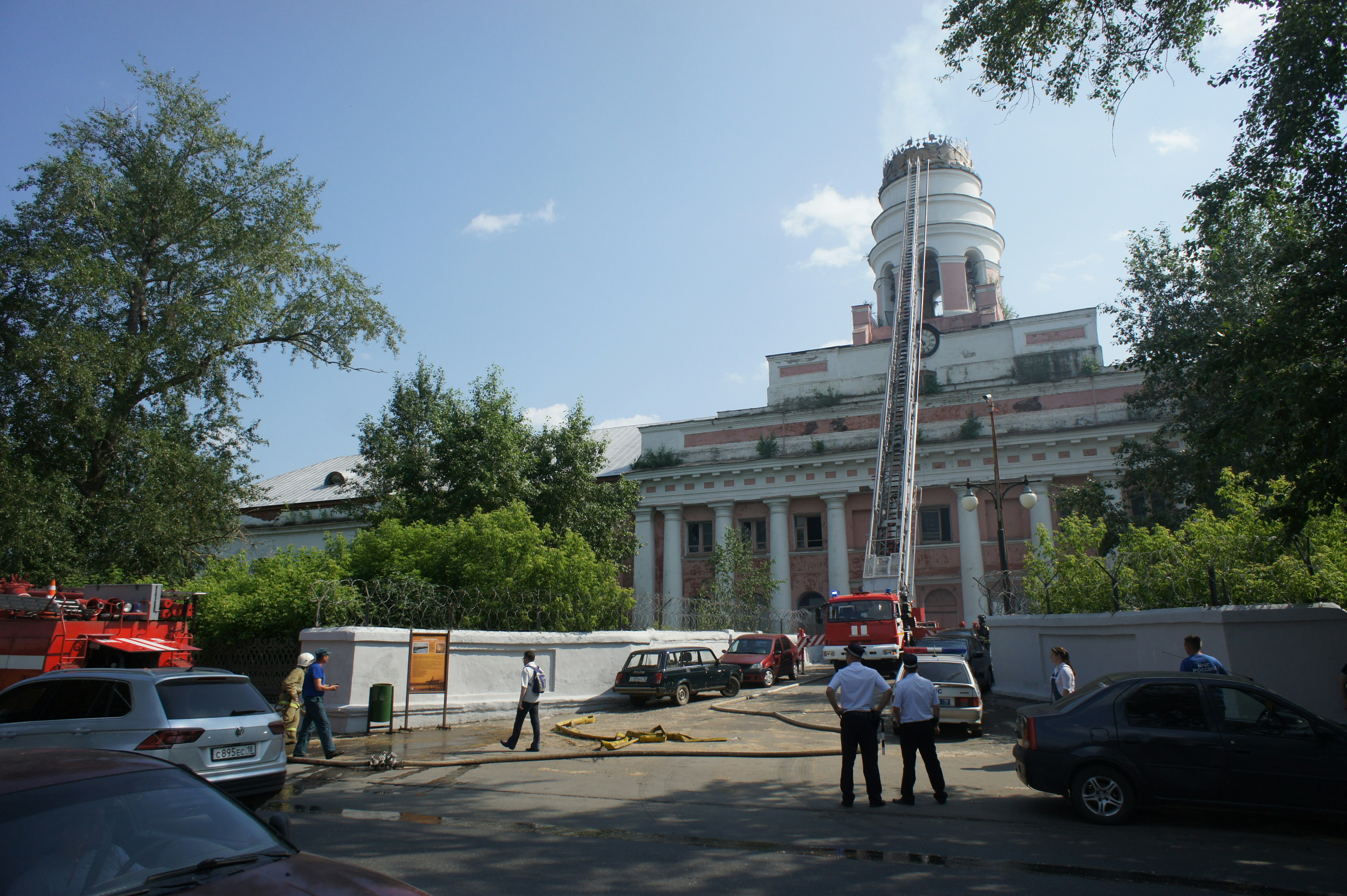 Firefighters respond to an emergency with a ladder truck.