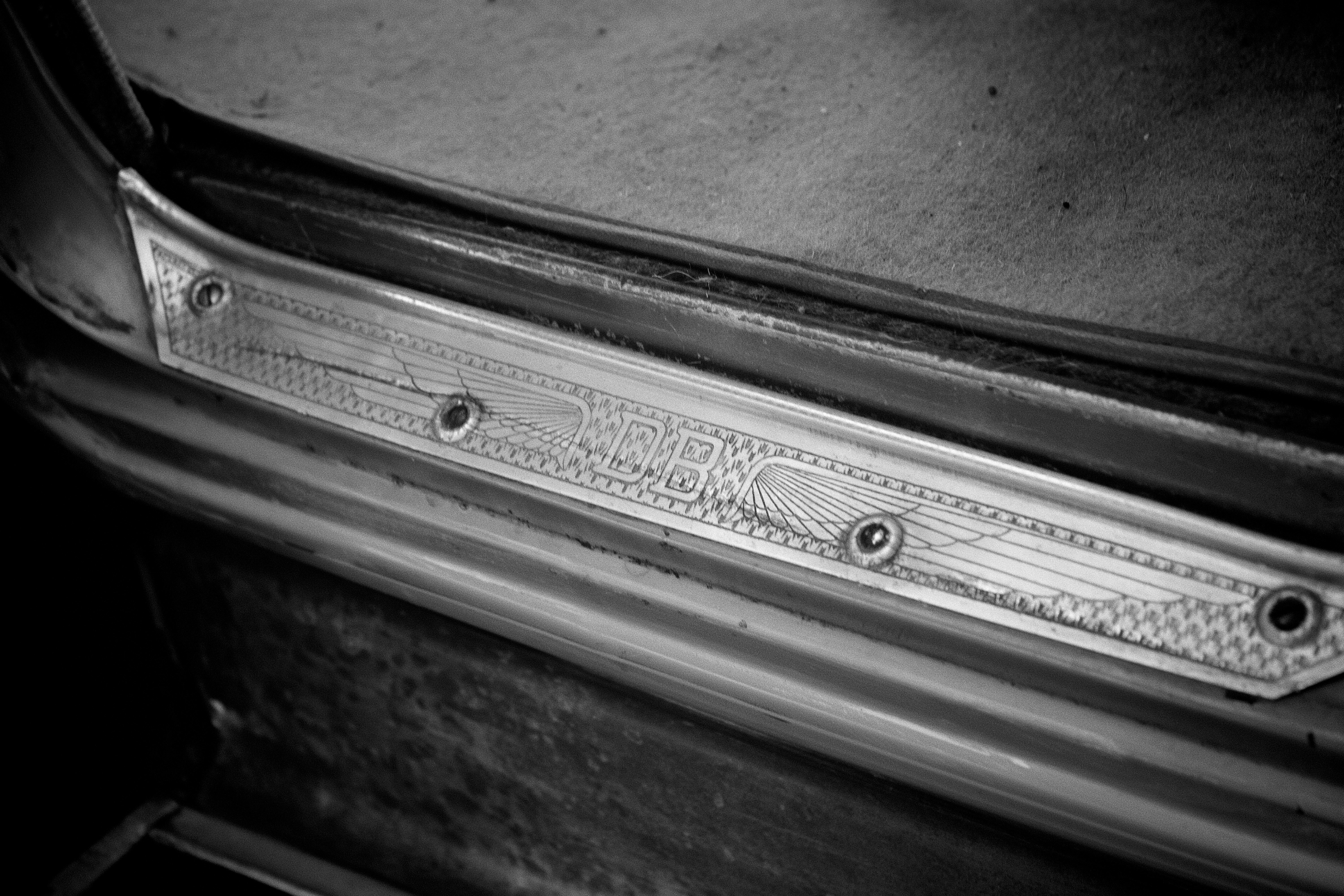 Close-up of vintage car door sill trim detail