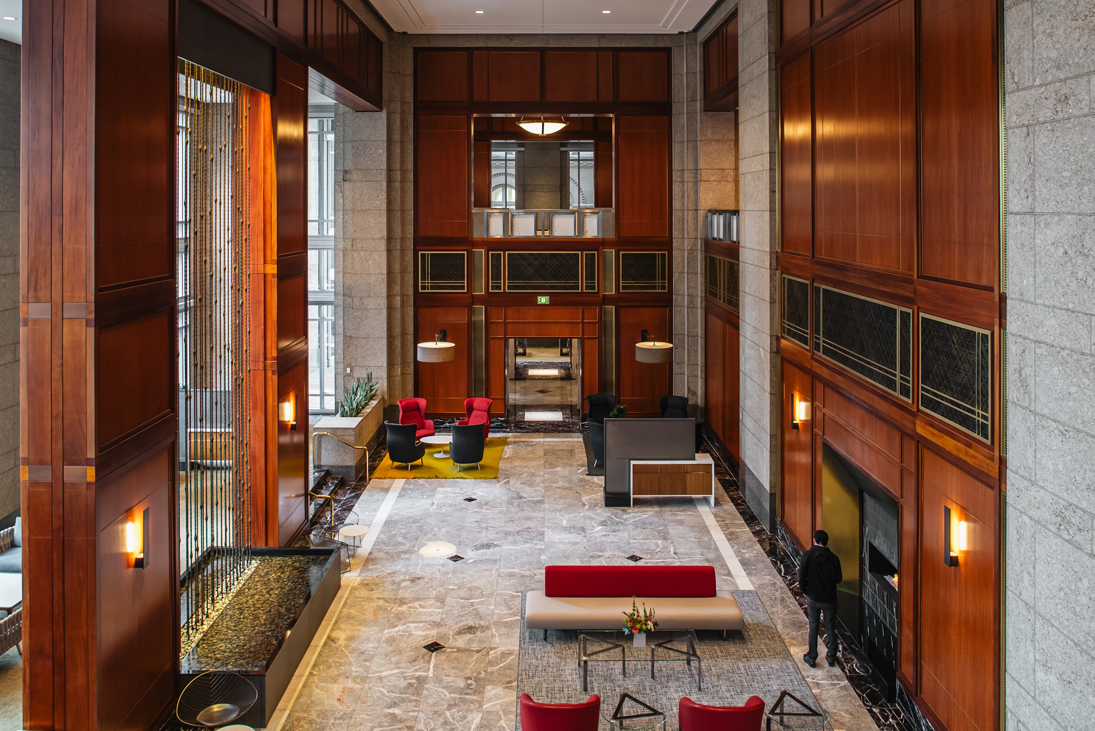 Elegant lobby with marble floors and wood paneling