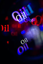 Abstract bokeh lights with the word "oil" repeated