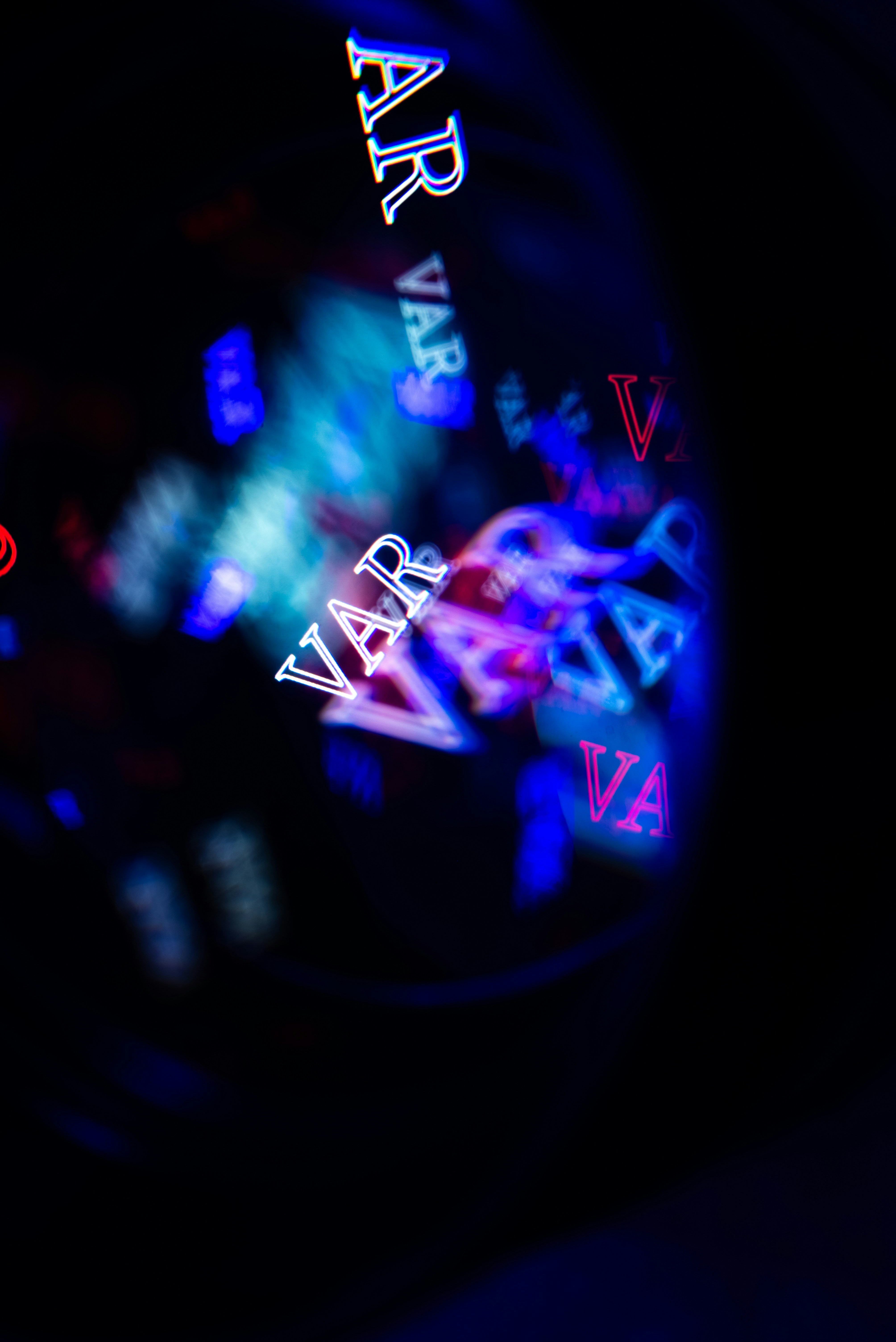 Blurry neon lights with the word var repeated.