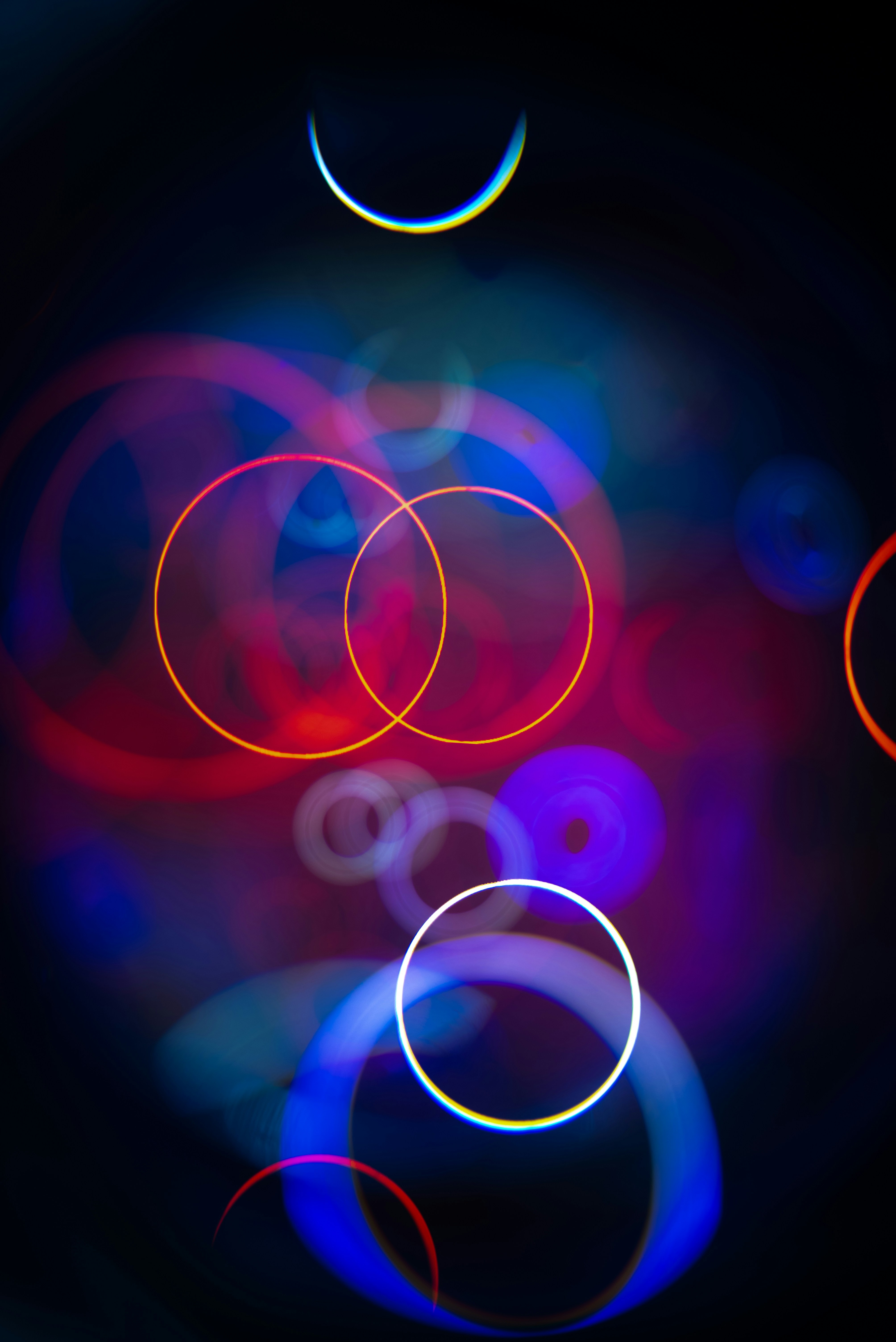 Abstract glowing circles and crescent moon shape