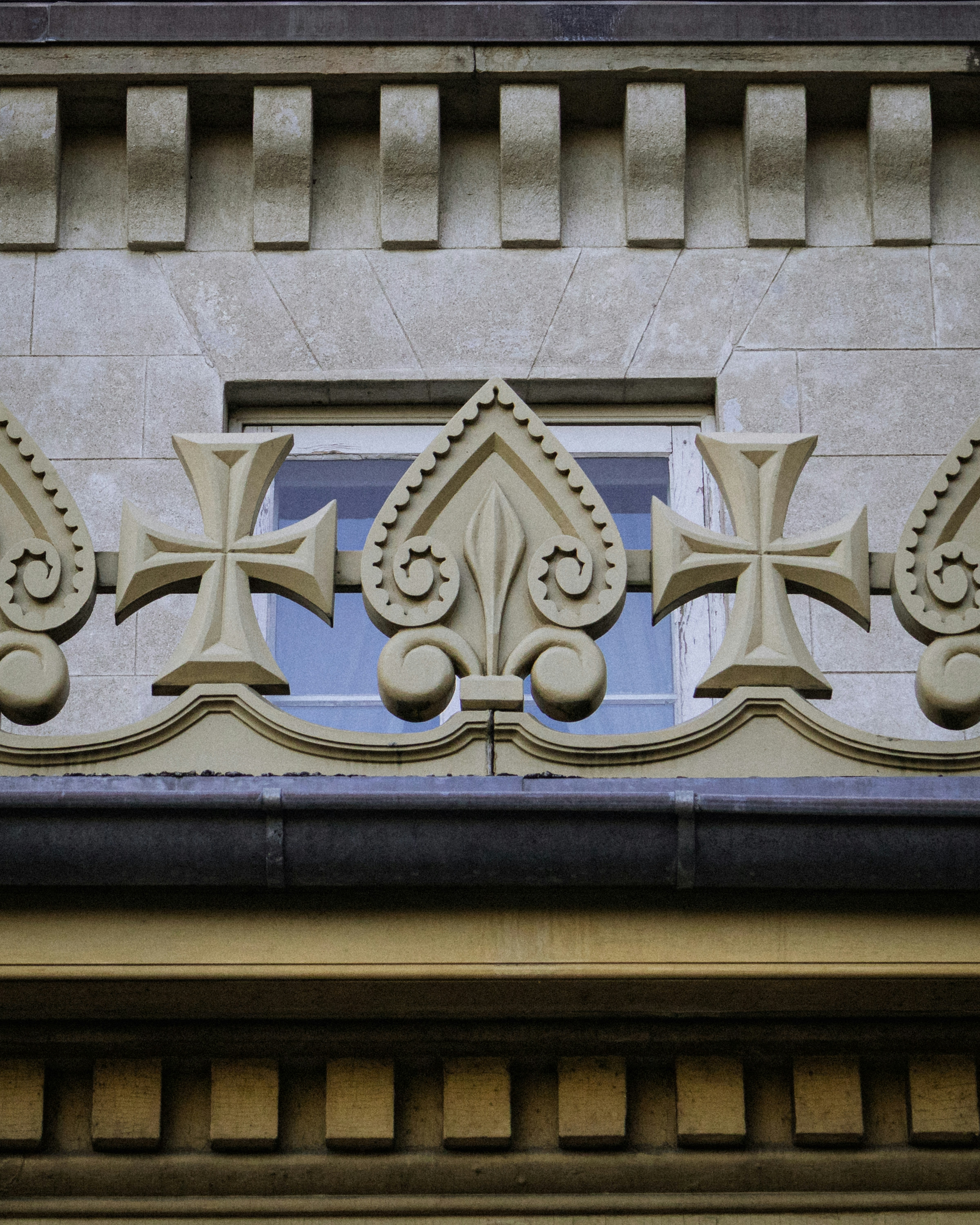 Ornate architectural details with crosses and floral motifs.