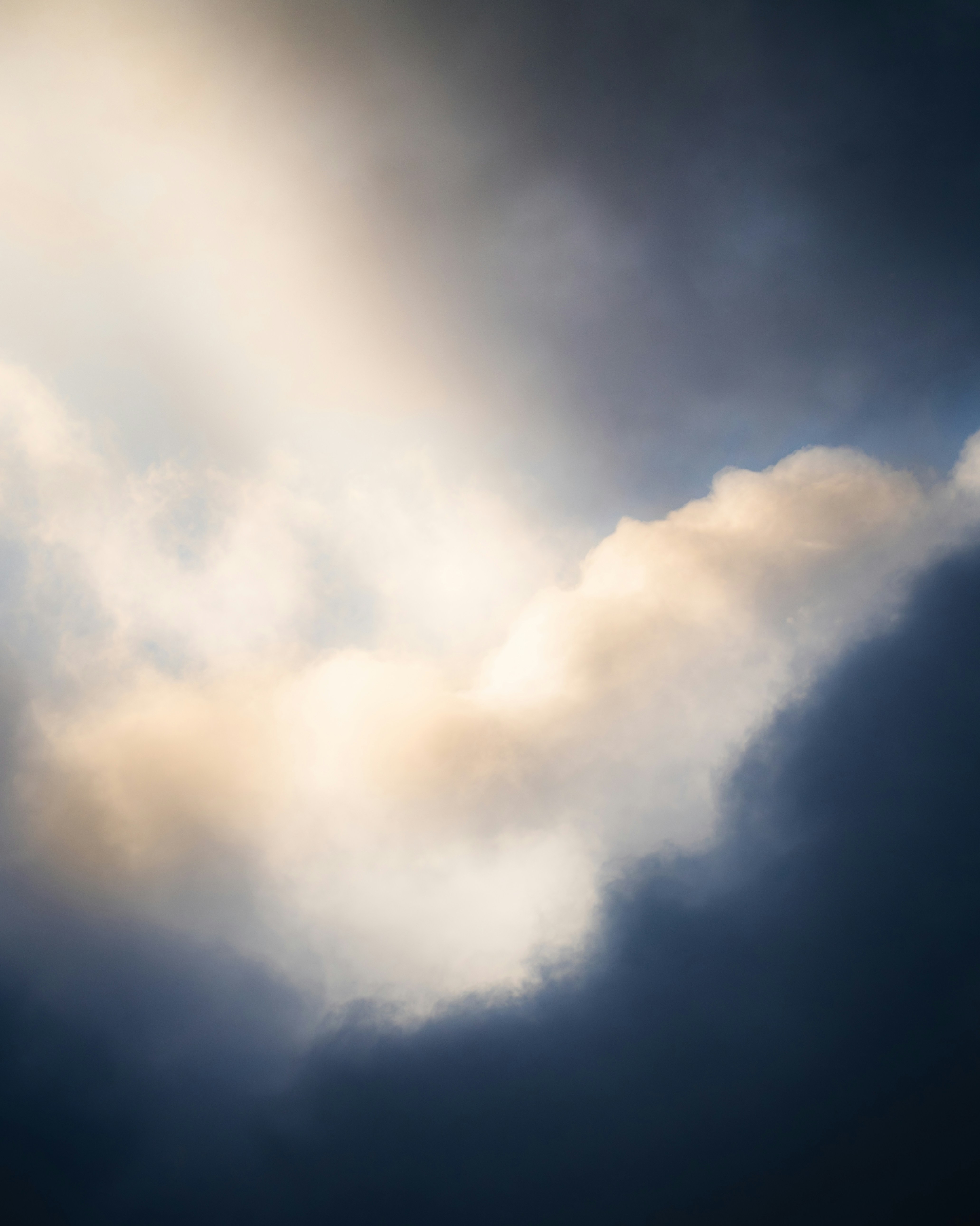 Dramatic clouds with golden light breaking through