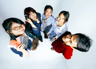 Five young people looking up from above