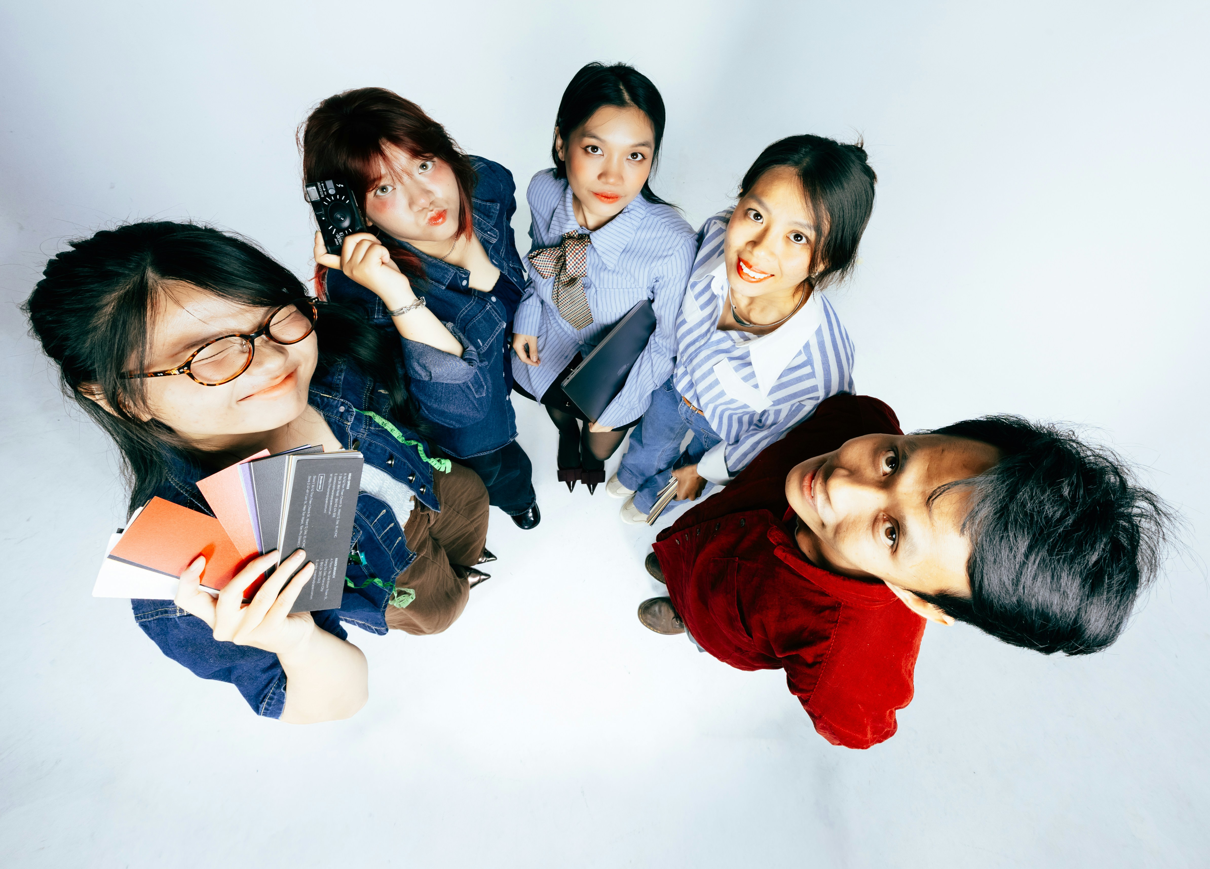 Five young people looking up from above