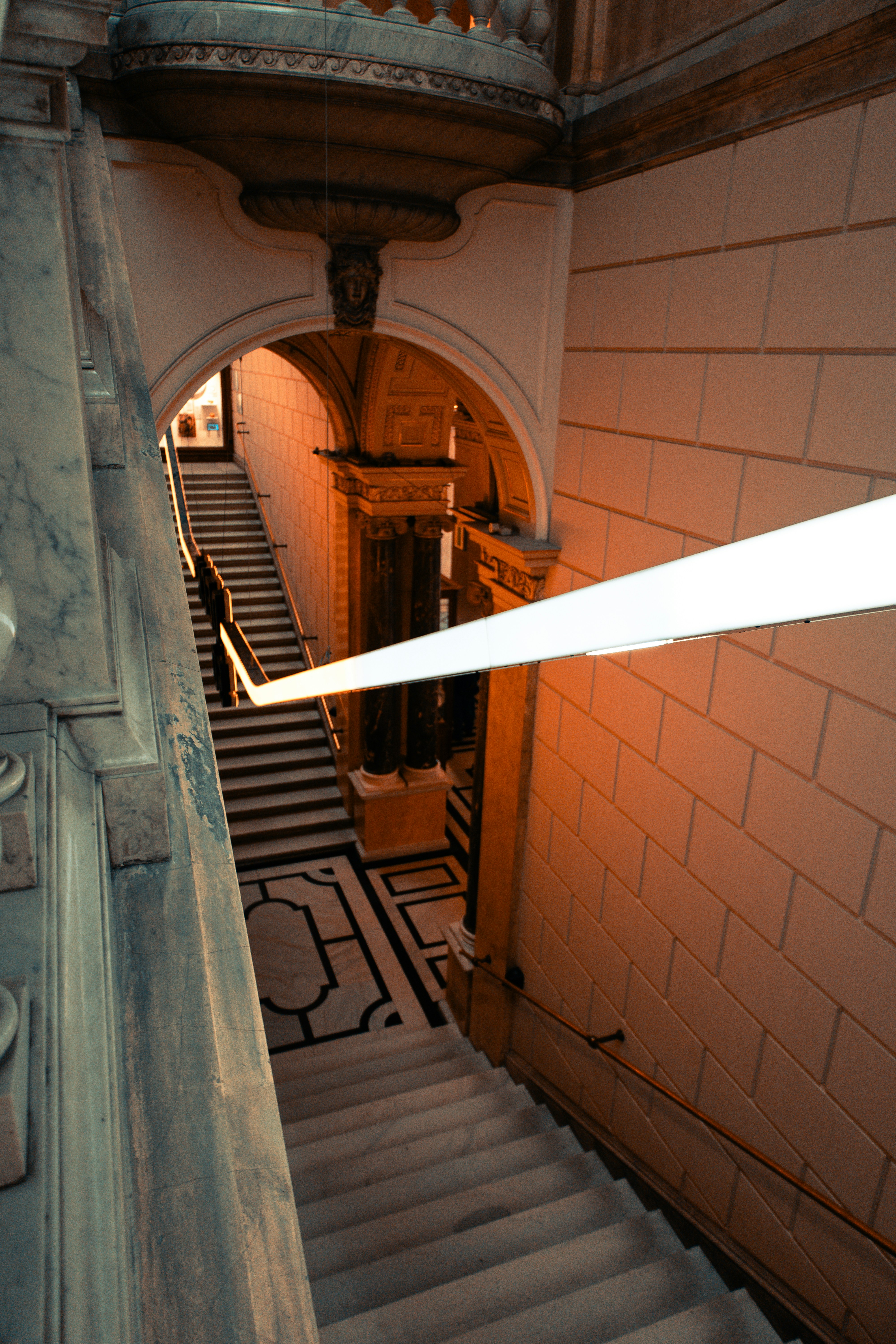 Elegant staircase with warm lighting and ornate details